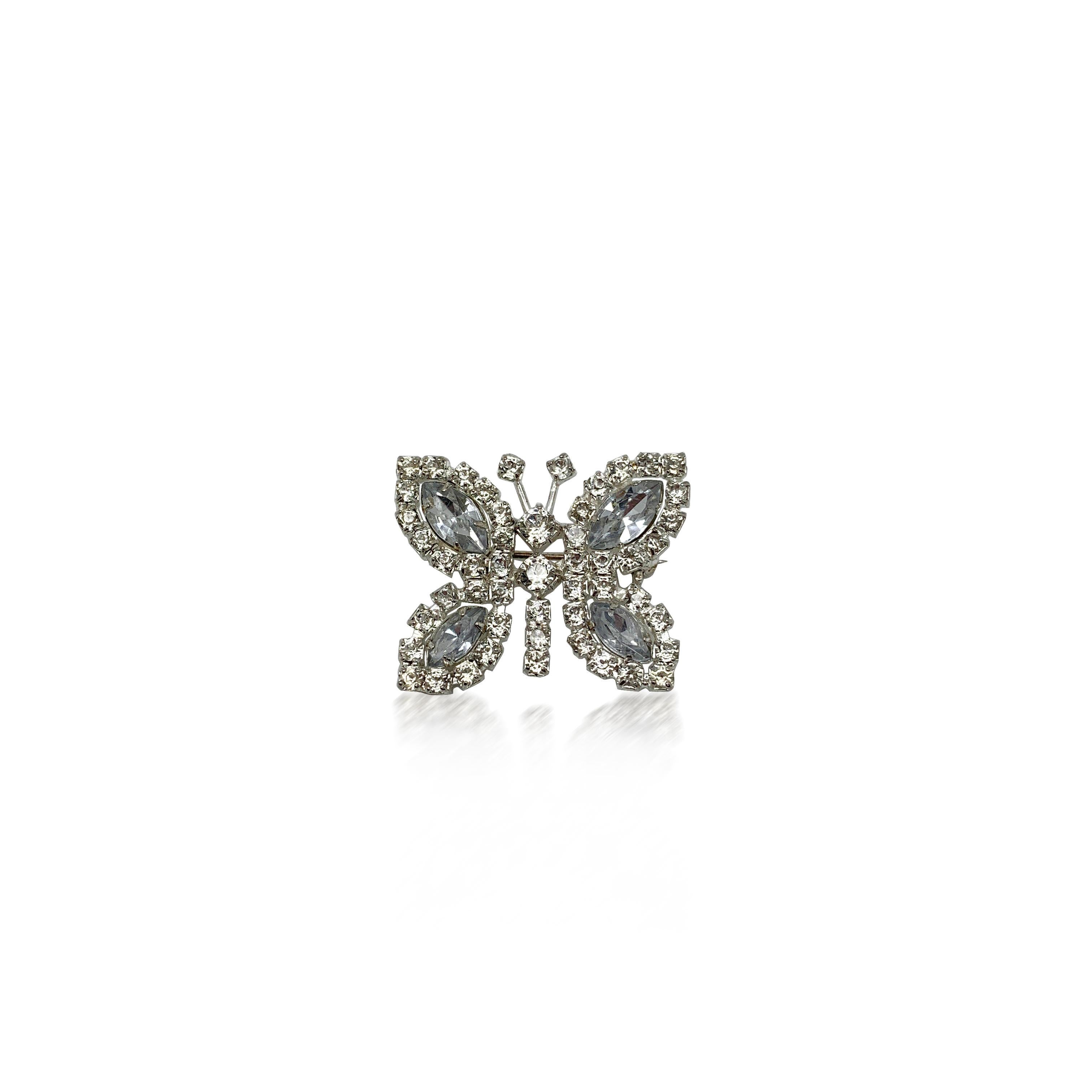 A small and very sweet vintage rhinestone butterfly pin. Featuring fancy cut crystals each one claw set.
Condition: Very good without damage or noteworthy wear. 
Materials: silver plated metal, glass crystals
Signed: unsigned
Fastening: rollover