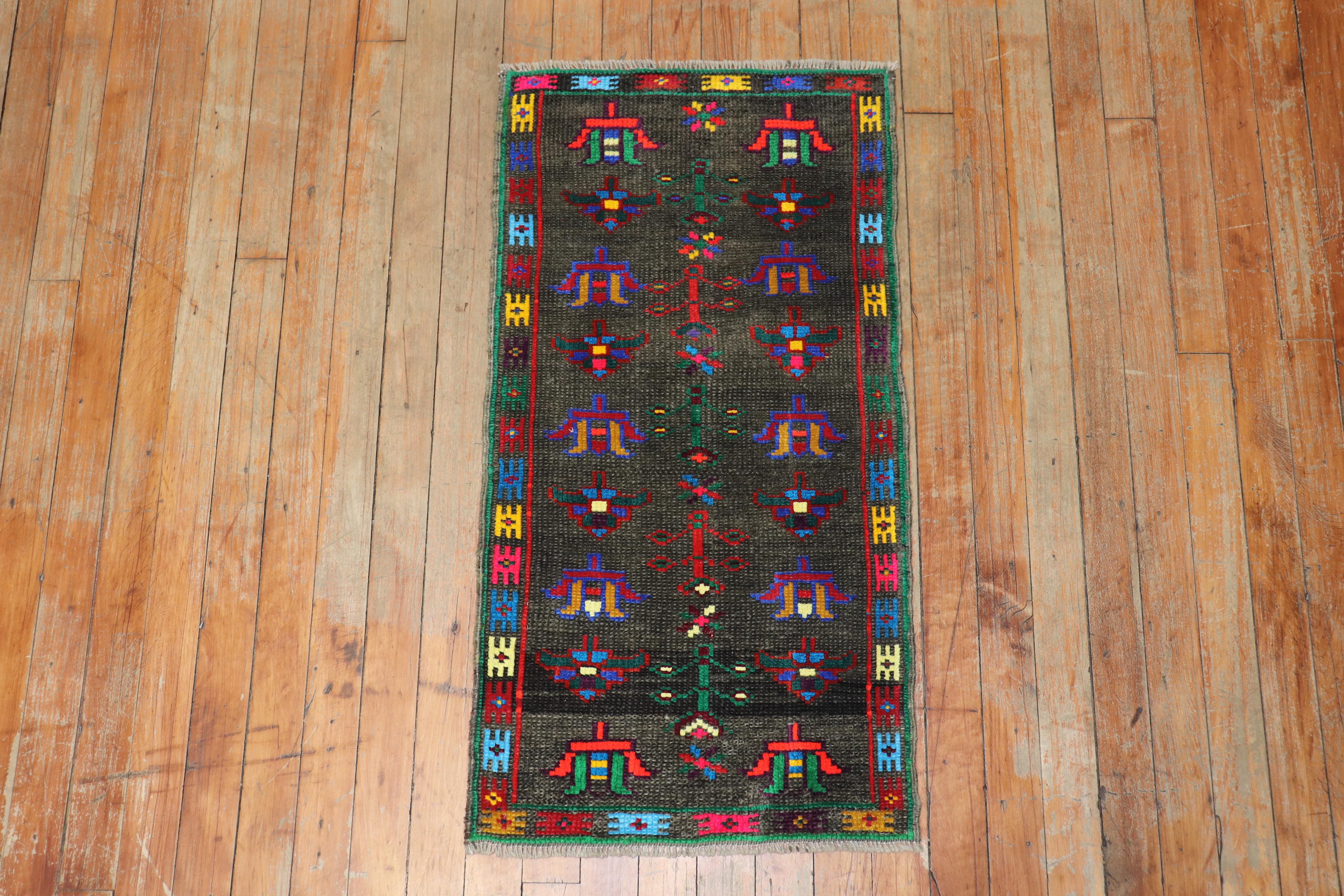 Quirky vintage Turkish Anatolian floral rug featuring vibrant colors on a brown ground.

Measures: 1'6' x 2'10