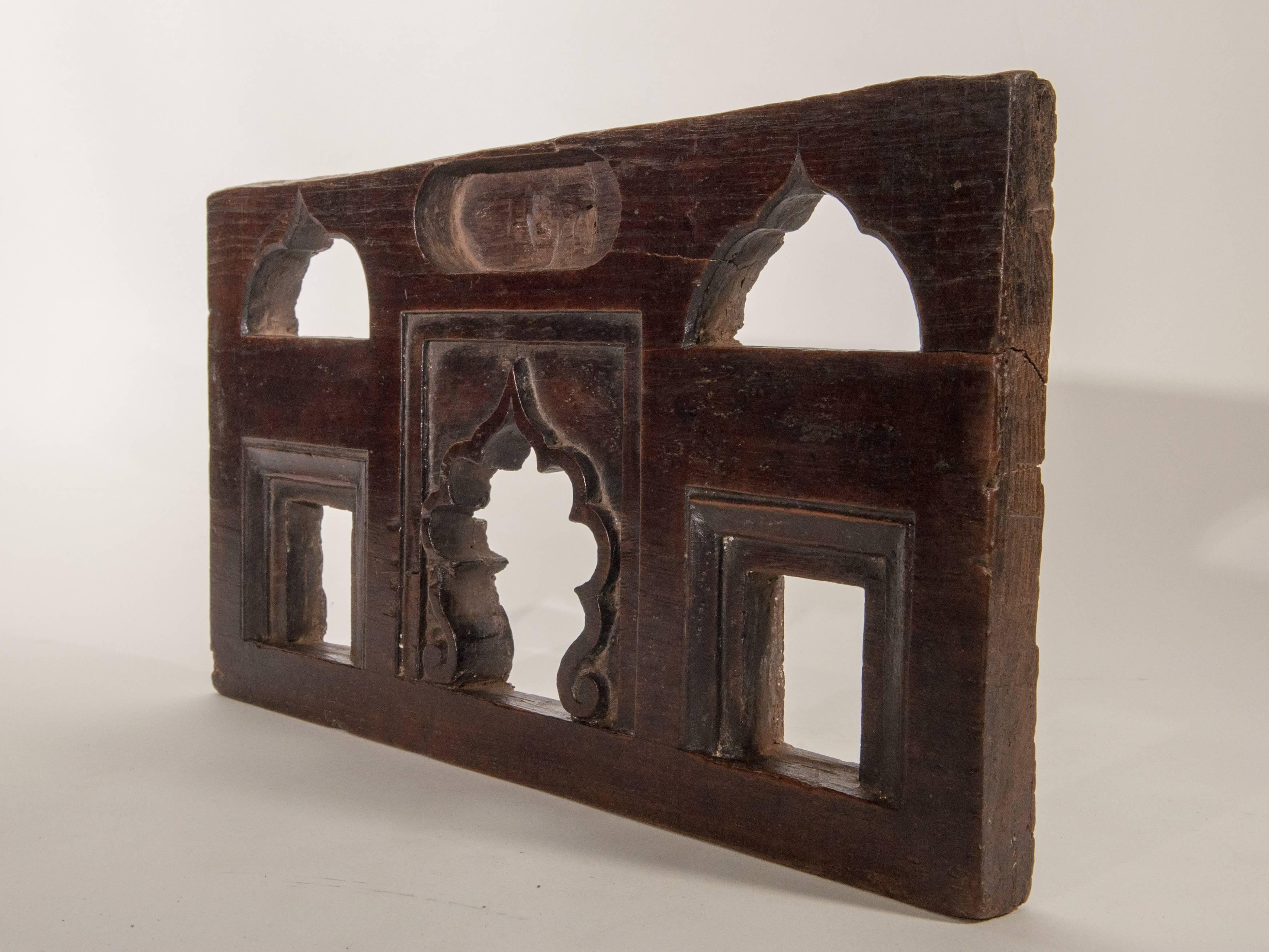 Vintage miniature architectural votive and picture frame, mid-20th century, India.
This vintage hand-carved wooden frame, from South India, was used to hold a small statue or picture of a Hindu Diety, very often a Garuda. It would have been placed