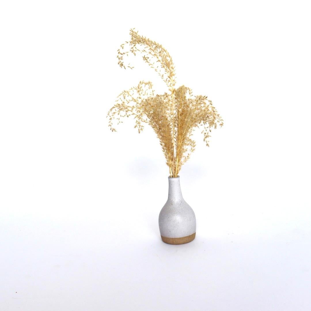 Vintage Miniature Bud Vase by Gordon and Jane Martz for Marshall Studios. 

Beautiful white and tan (unglazed) color in very good condition with a faint signature on the underside. Add this charming neutral two-toned bud vase to your already