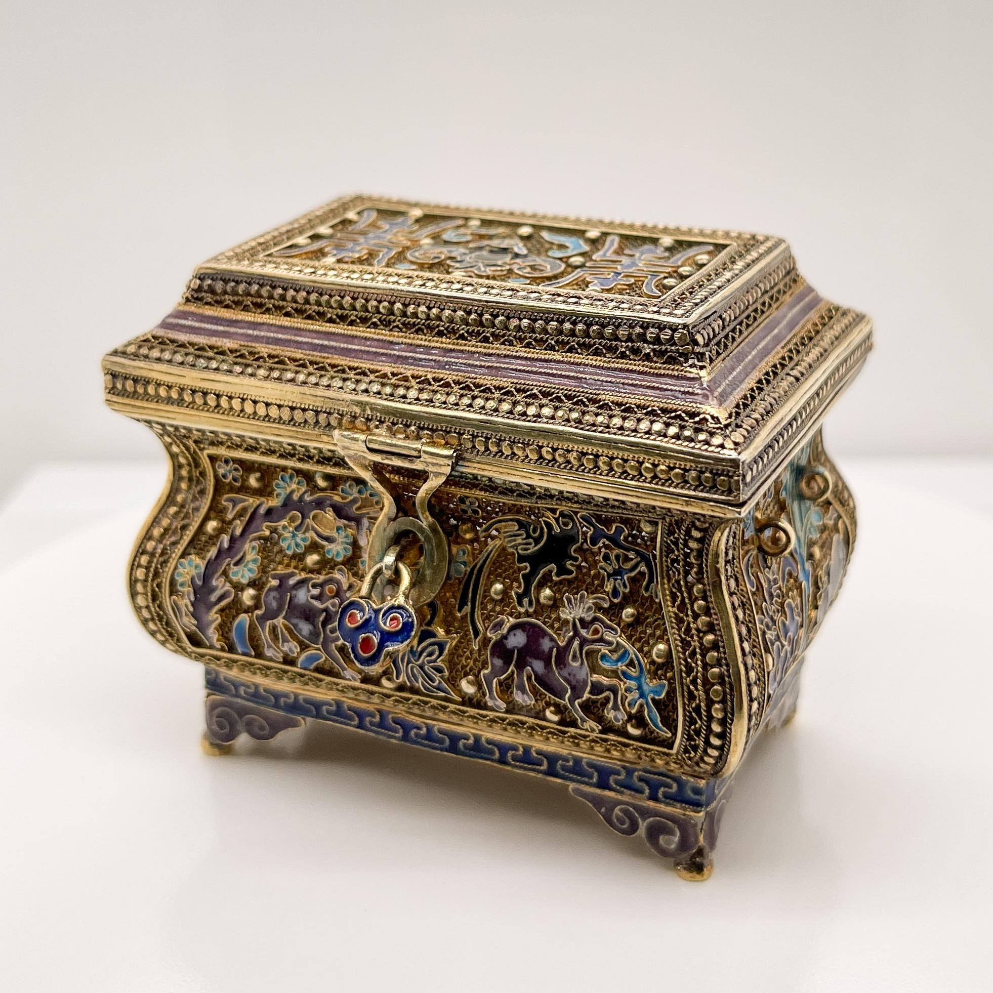 A fine vintage Chinese miniature box or treasure chest.

In gilt filigree silver and enamel. 

Eternally sealed with a faux lock. 

Simply a wonderful miniature Chinese objet d'art!

Date:
20th Century

Overall Condition:
It is in overall good,
