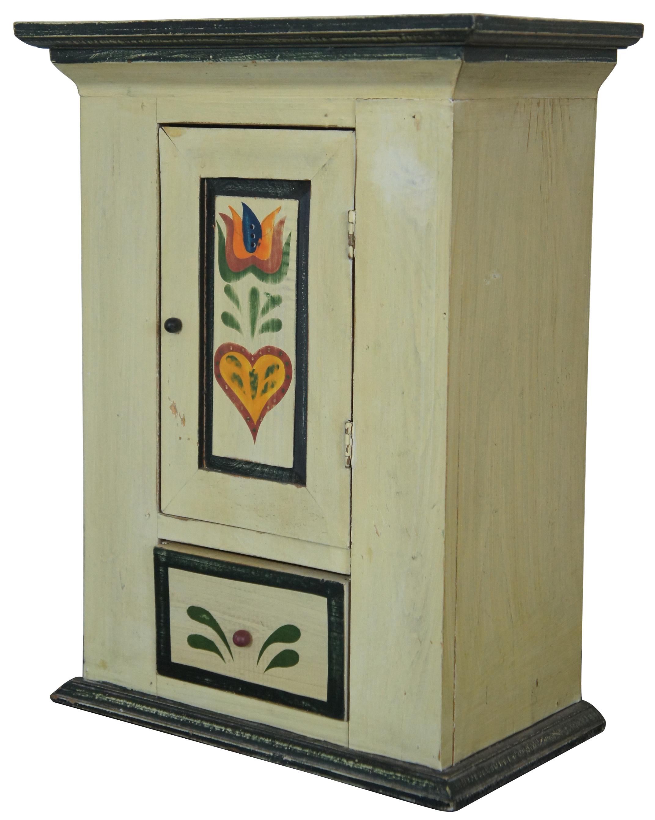 Vintage Folk Art hand painted miniature cabinet with two shelves and one drawer. Measures: 16”.
   