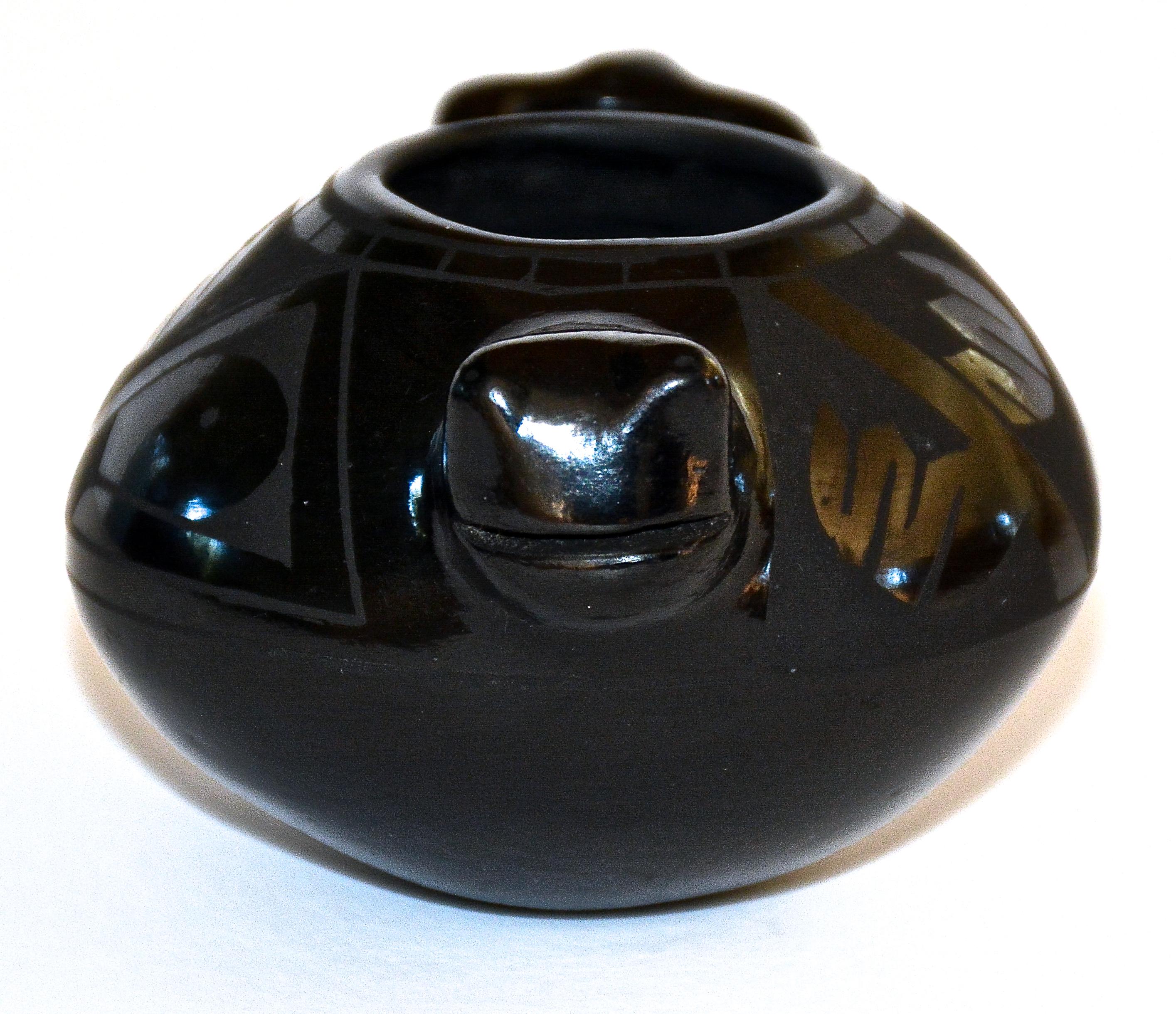 Vintage Mata Ortiz Tadpole Fetish Pot
Cesar Dominguez (b. 1961 - )
1989
Hand-Coiled low fire clay
Mata Ortiz, Chihuahua, Mexico

This miniature Tadpole Fetish Pot is a rare and very early example (1989) from this first generation Mata Ortiz