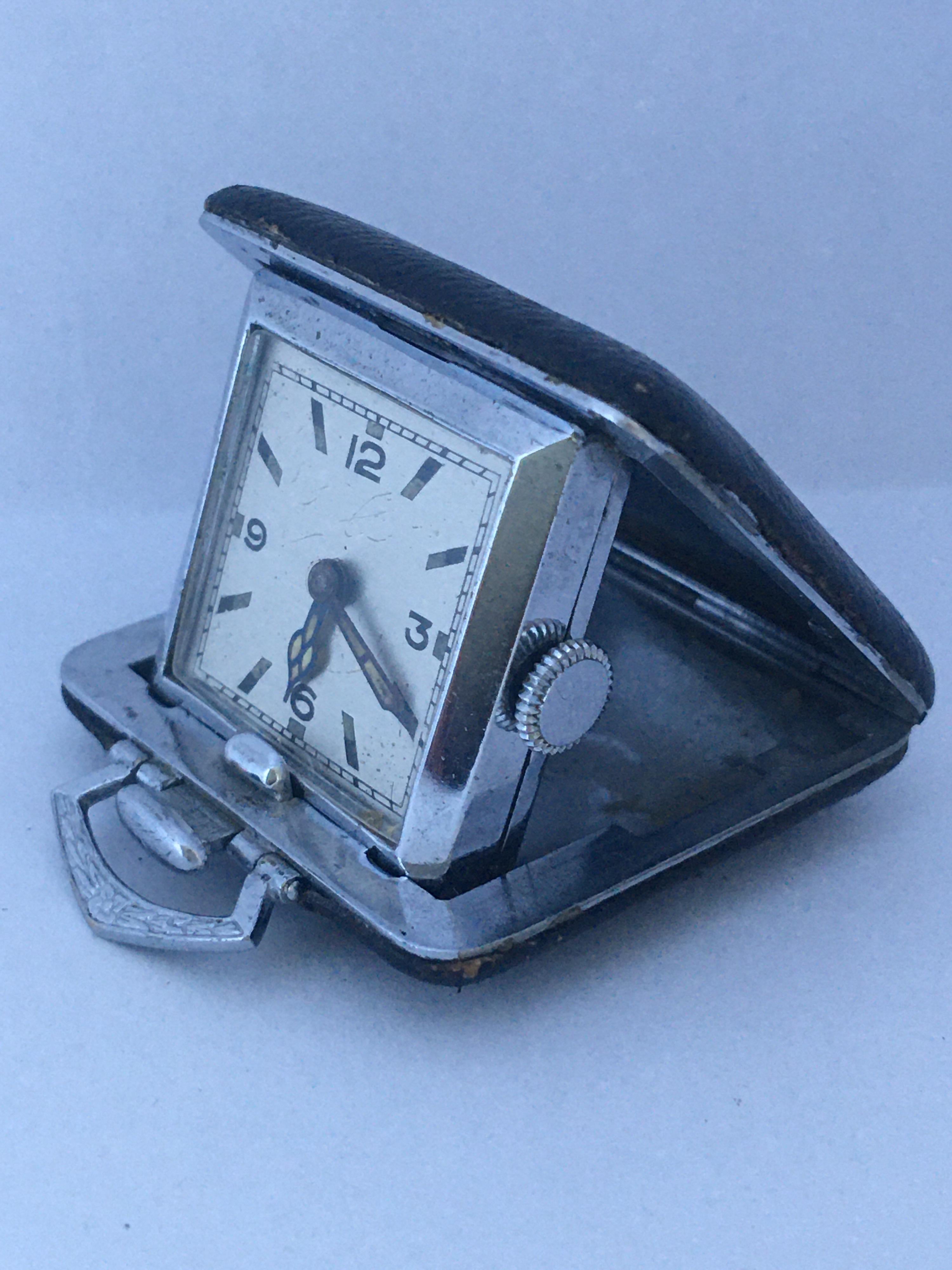 This clock is in good working condition and it is ticking well. Visible signs of ageing and wear with light scratches on the silver plated case and on the glass. The black cover case is a bit worn as shown. 

Please study the images carefully as