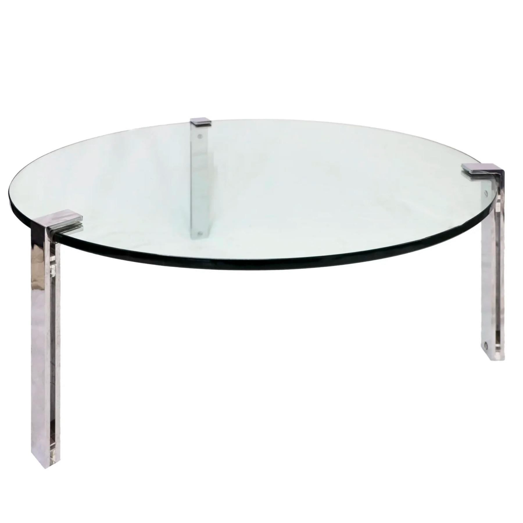 Sleek and understated, this vintage minimalist coffee table pairs a thick glass top with a streamlined 3-leg chrome frame, offering a timeless blend of function and form. Glass is suspended seamlessly between 3 chrome legs.

Age is consistent with