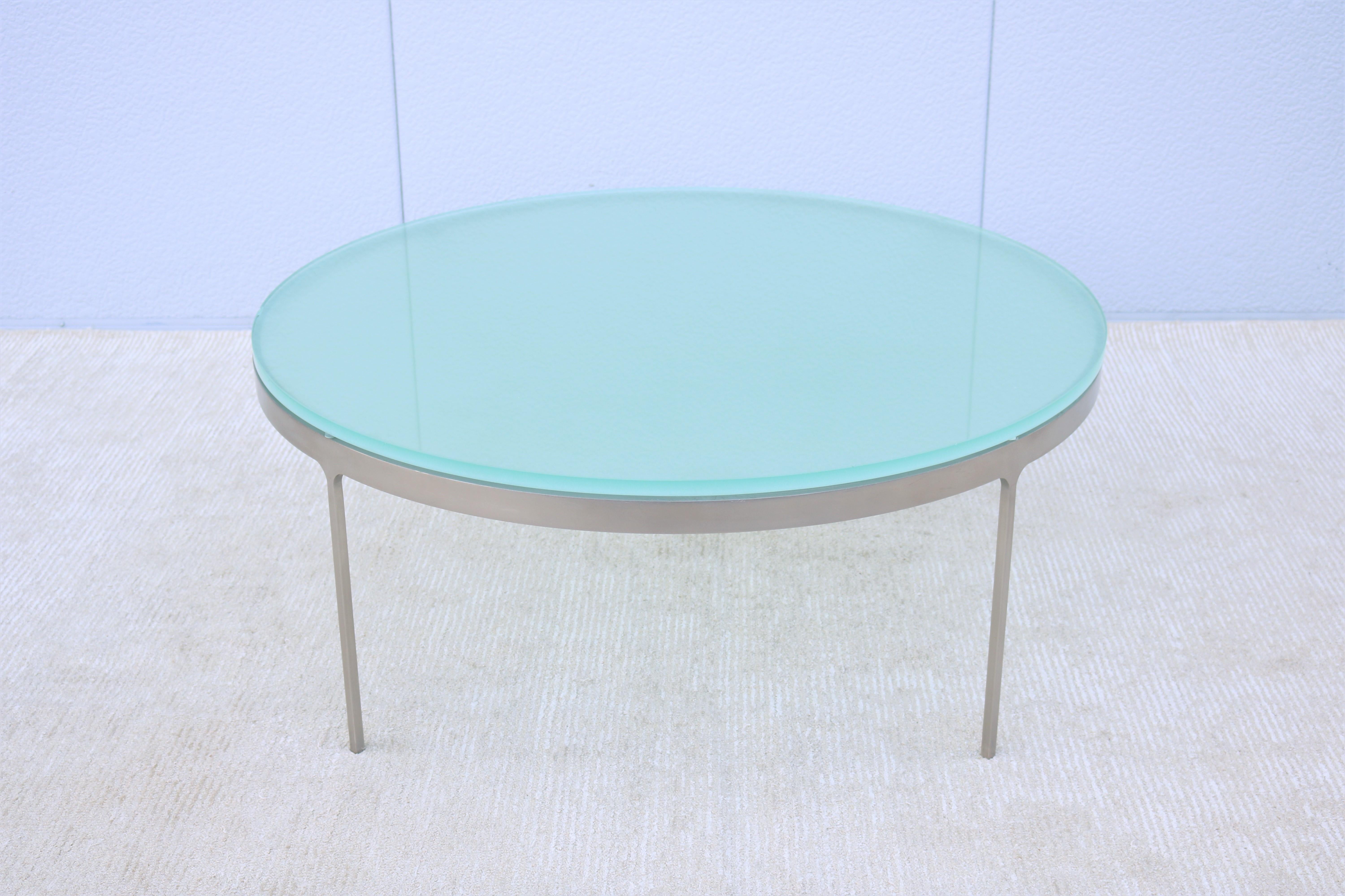 A stunning Minimalist round glass and stainless steel coffee table designed by Nicos Zographos in 1960 and remains a current timeless and elegant design today.
Zographos' signature design details in his TA35 series were the use of a solid stainless