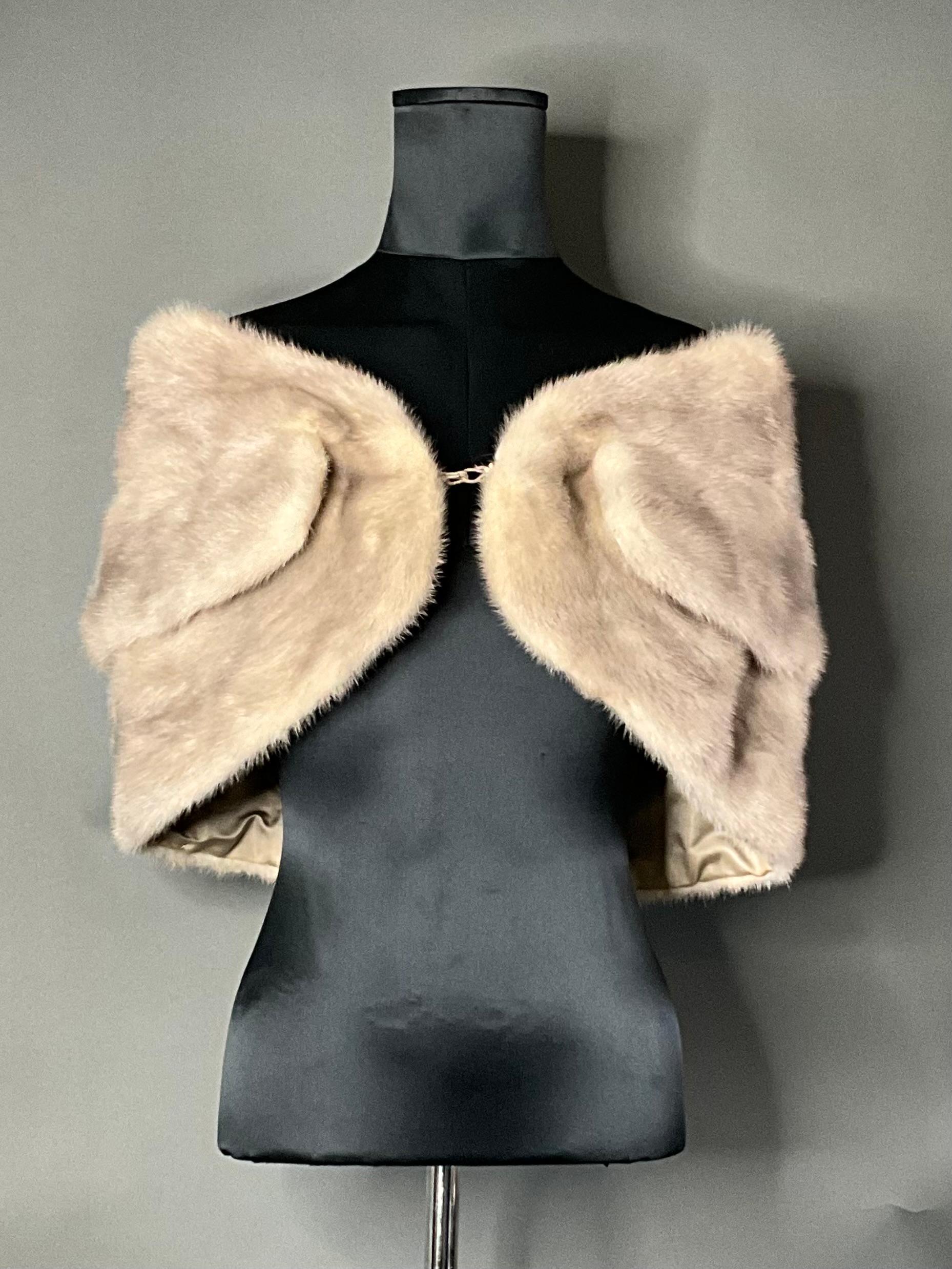The Vintage Mink Fur Shawl is a luxurious and timeless accessory that brings sophistication and glamour to any wardrobe. Made from soft, high-quality mink fur, it offers both warmth and style, making it the perfect addition to formal and special