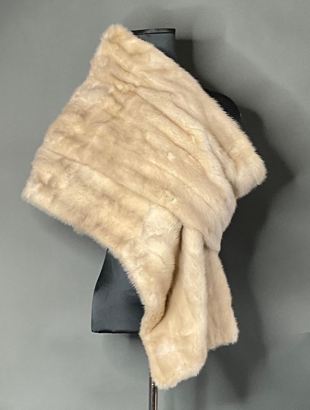 The Vintage Mink Fur Shawl is a luxurious and timeless accessory that brings sophistication and glamour to any wardrobe. Made from soft, high-quality mink fur, it offers both warmth and style, making it the perfect addition to formal and special