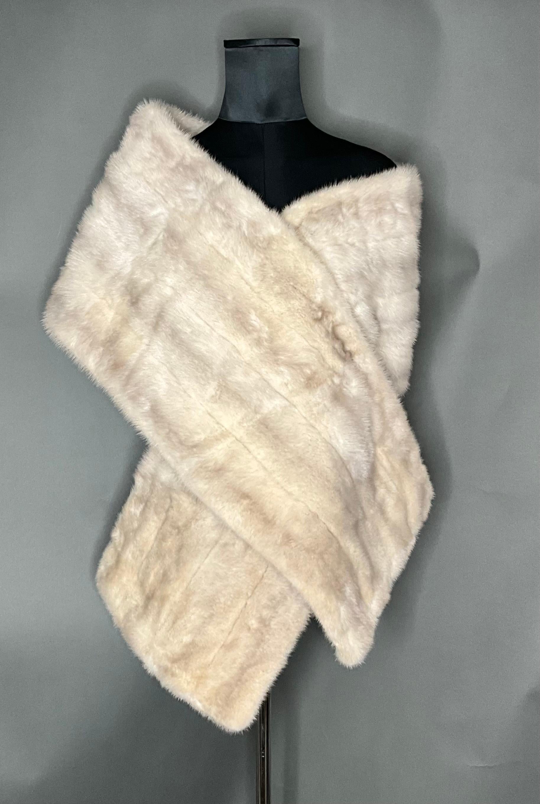 The Vintage Mink Fur Stole is a luxurious and timeless accessory that brings sophistication and refinement to any outfit. Crafted from high-quality mink fur, this stole offers warmth and style, making it ideal for formal events, evening wear, or