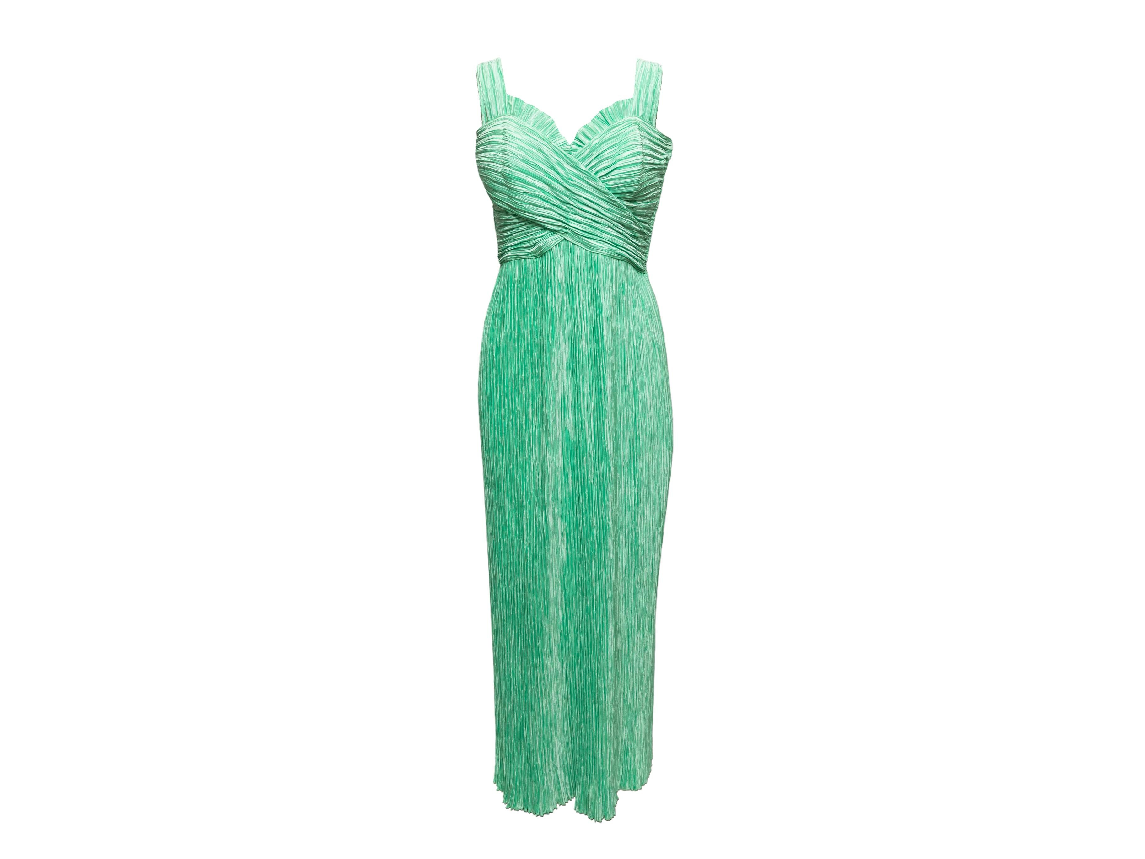 Vintage mint plisse sleeveless dress by Mary McFadden. Sweetheart neckline. Zip closure at side. 36