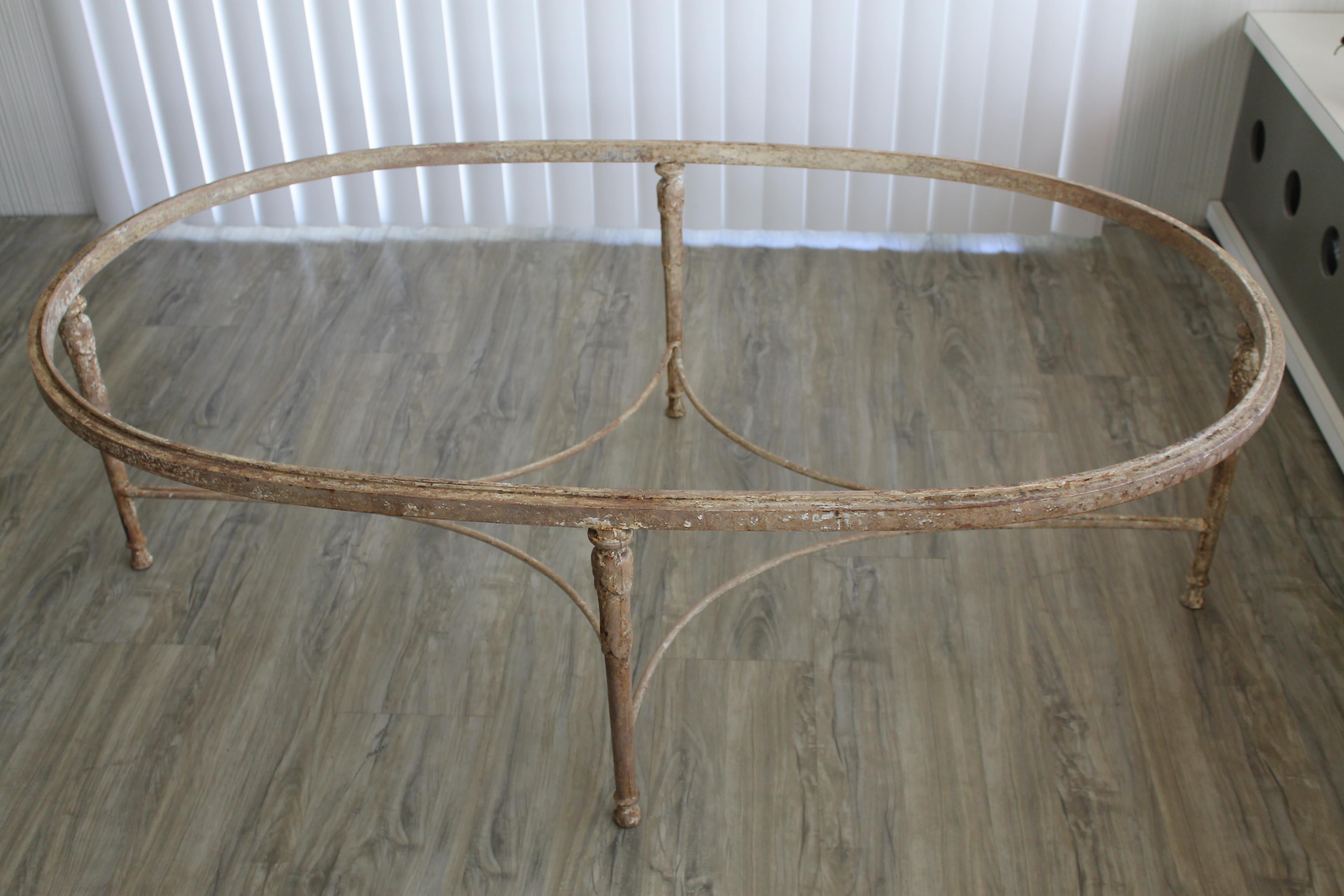 An older version of one of Minton Spidell's classic designs, this coffee table dates from the 1960s. Original finish has aged and crackled, finished with wax for original vintage look. One half inch thick glass top appears to be original to the