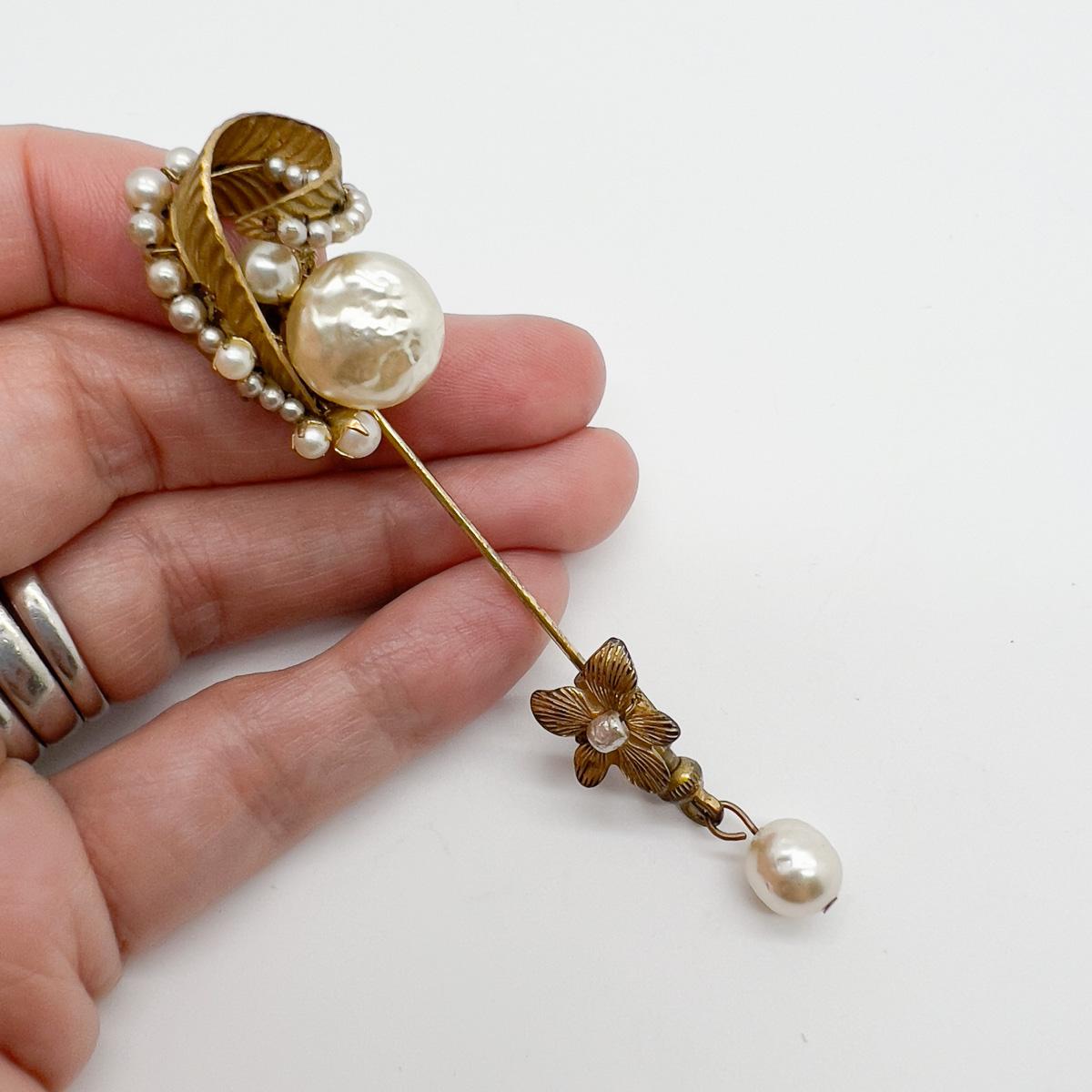 A delightful and rare Vintage Miriam Haskell Pearl Droplet Pin crafted in the 1940s, nearly 100 years ago. The attention to detail in this pin is exquisite and signifies the craftmanship at play in Haskell's work. A rare and ultra chic way to