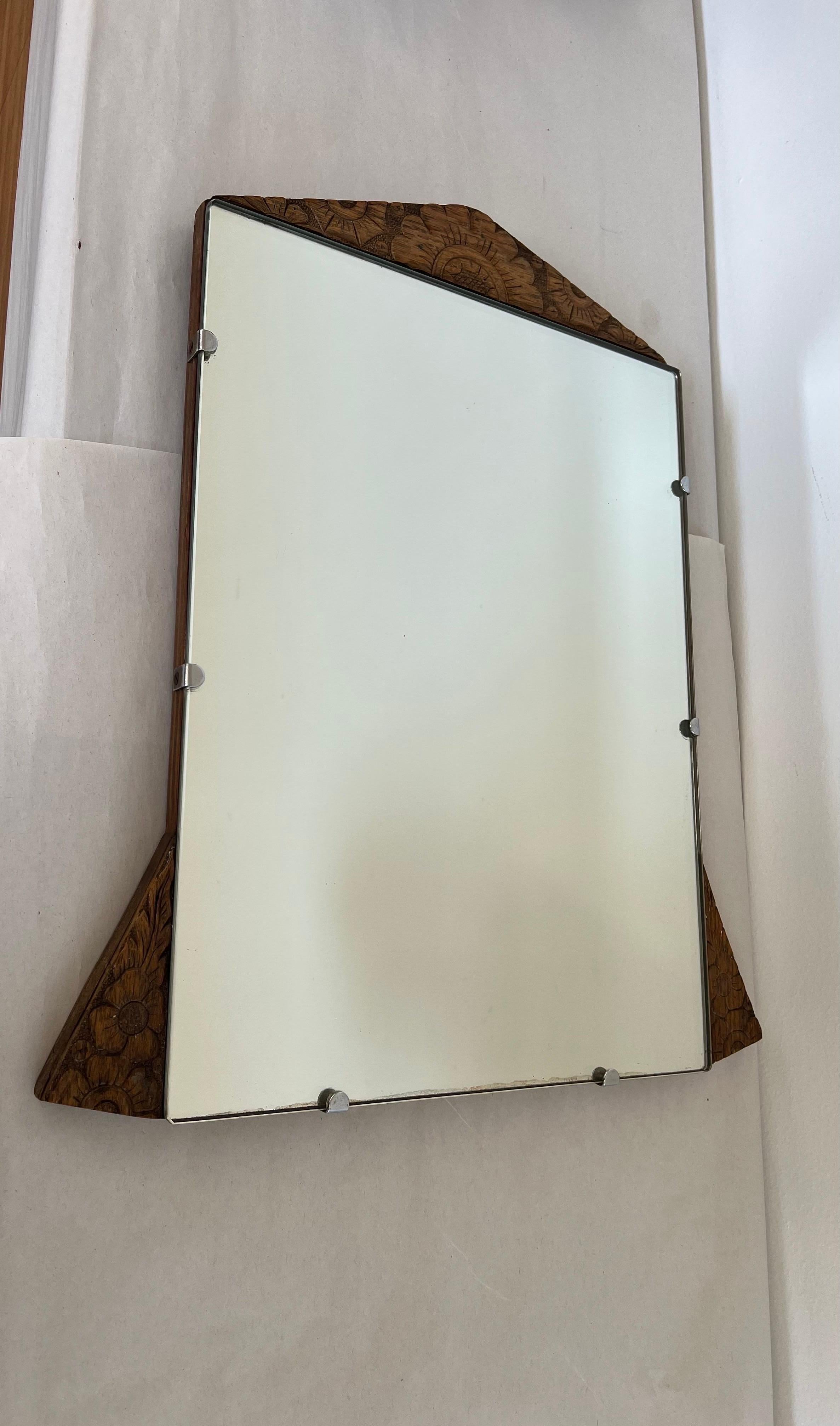 Vintage Mirror Art Deco Style with Floral Carvings Possible Circa 1950s - 1970s Interesting Patina Wood and Hardware

Dimensions. 15 1/2 W ; 18 H ; 3/4 D.