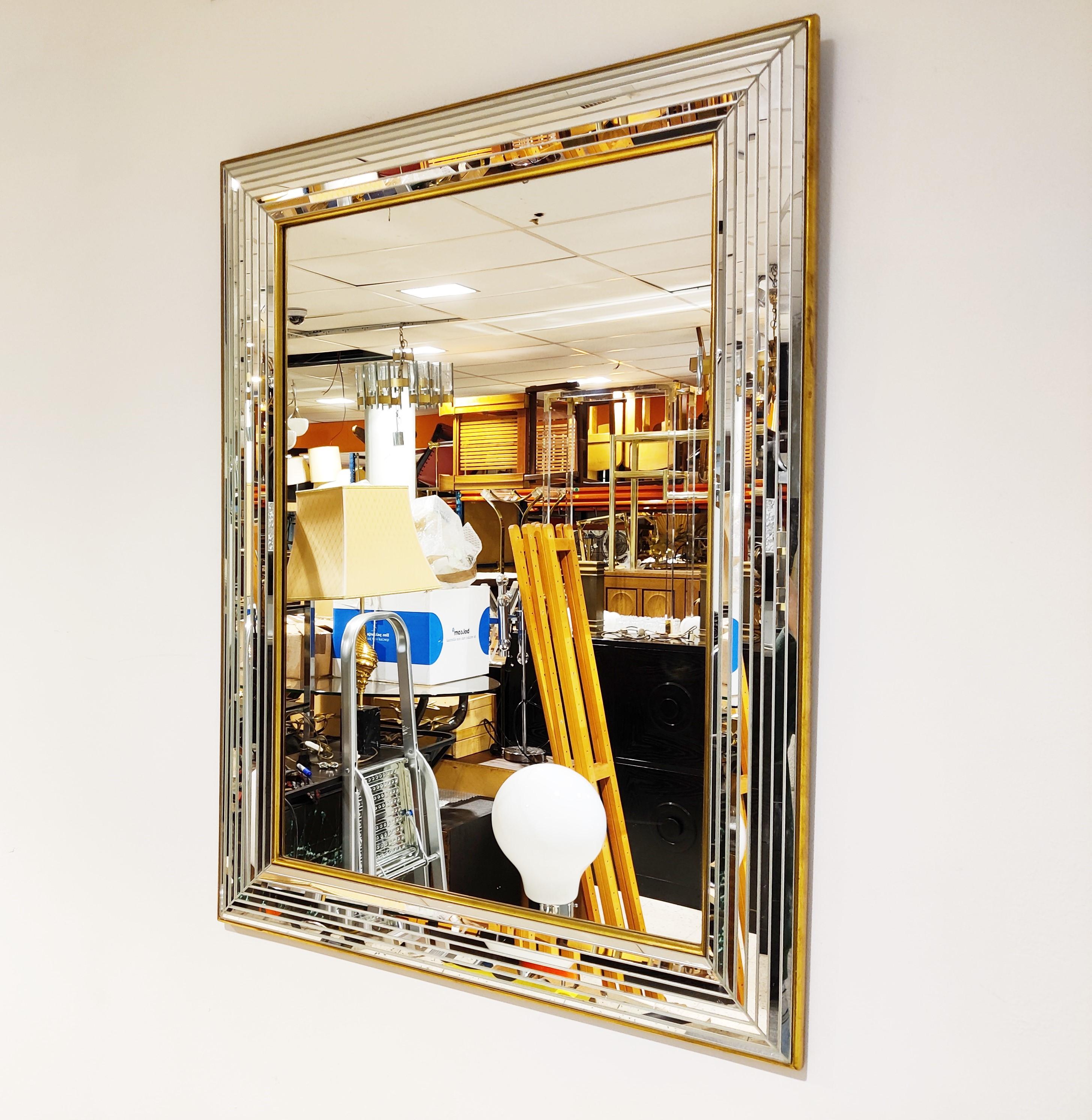 Seventies wall mirror made in Belgium.

Beautiful multi layer mirror glass edge with gilded finish.

This mirror was made by Deknudt.

1970s - Belgium

Dimensions:

Height: 85cm/33.46