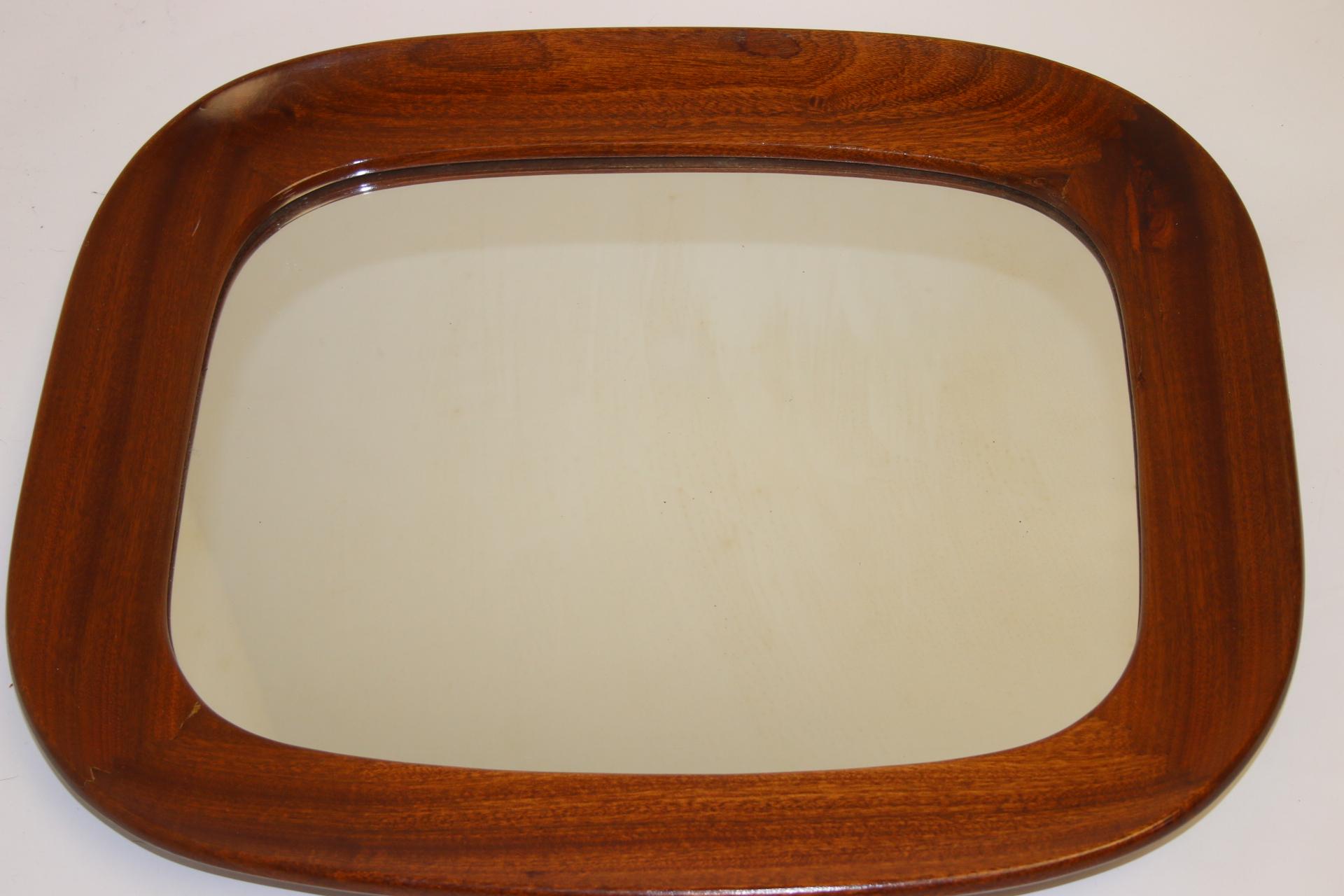 Vintage mirror with wide wooden rim.


This is a beautiful mirror with a wide teak lacquered edge. The edge is 8 cm wide.

The mirror is 45x35, there is a shelf at the back with which the mirror is fixed. If you want this beautiful mirror on