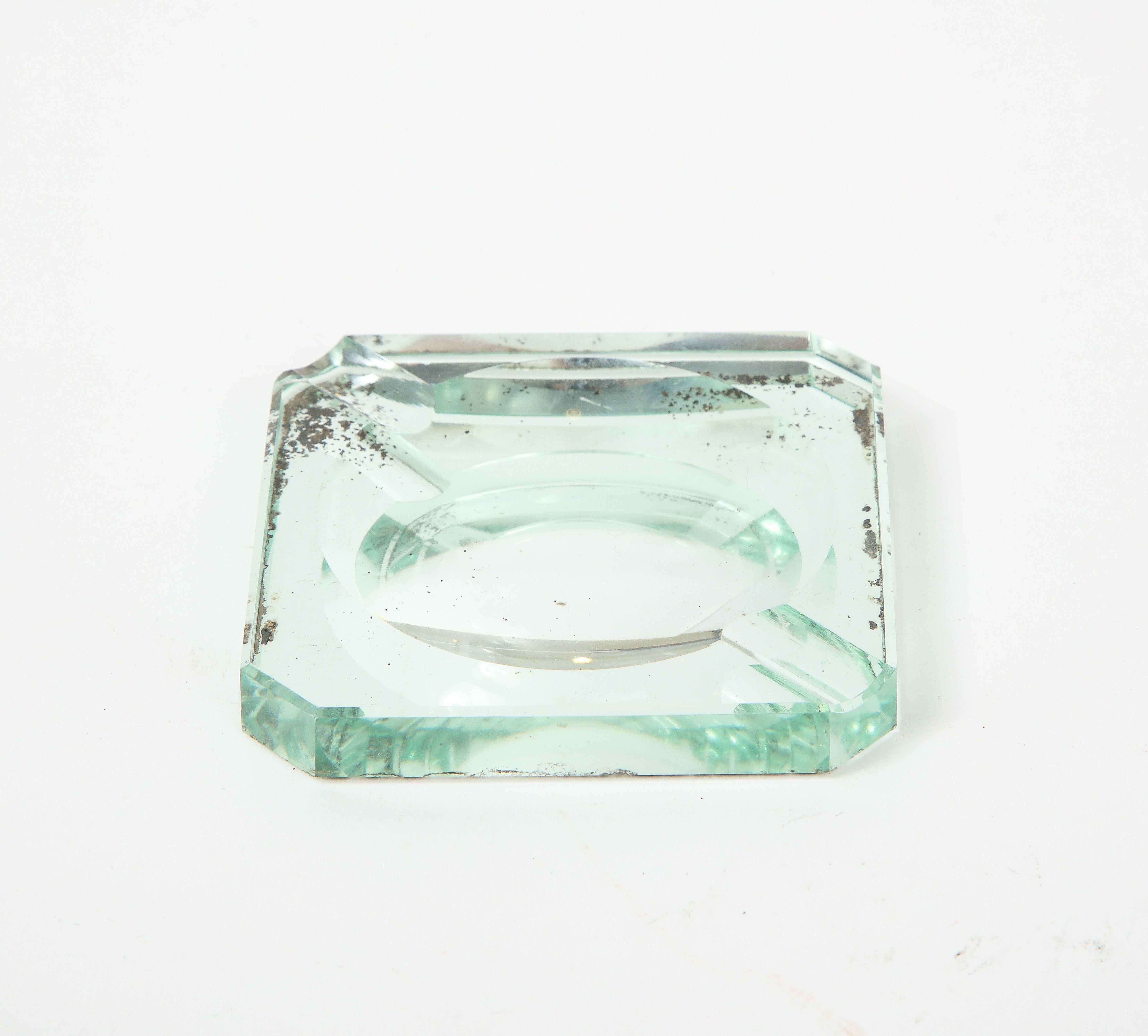 Vintage mirrored ashtray in a hexagonal shape.