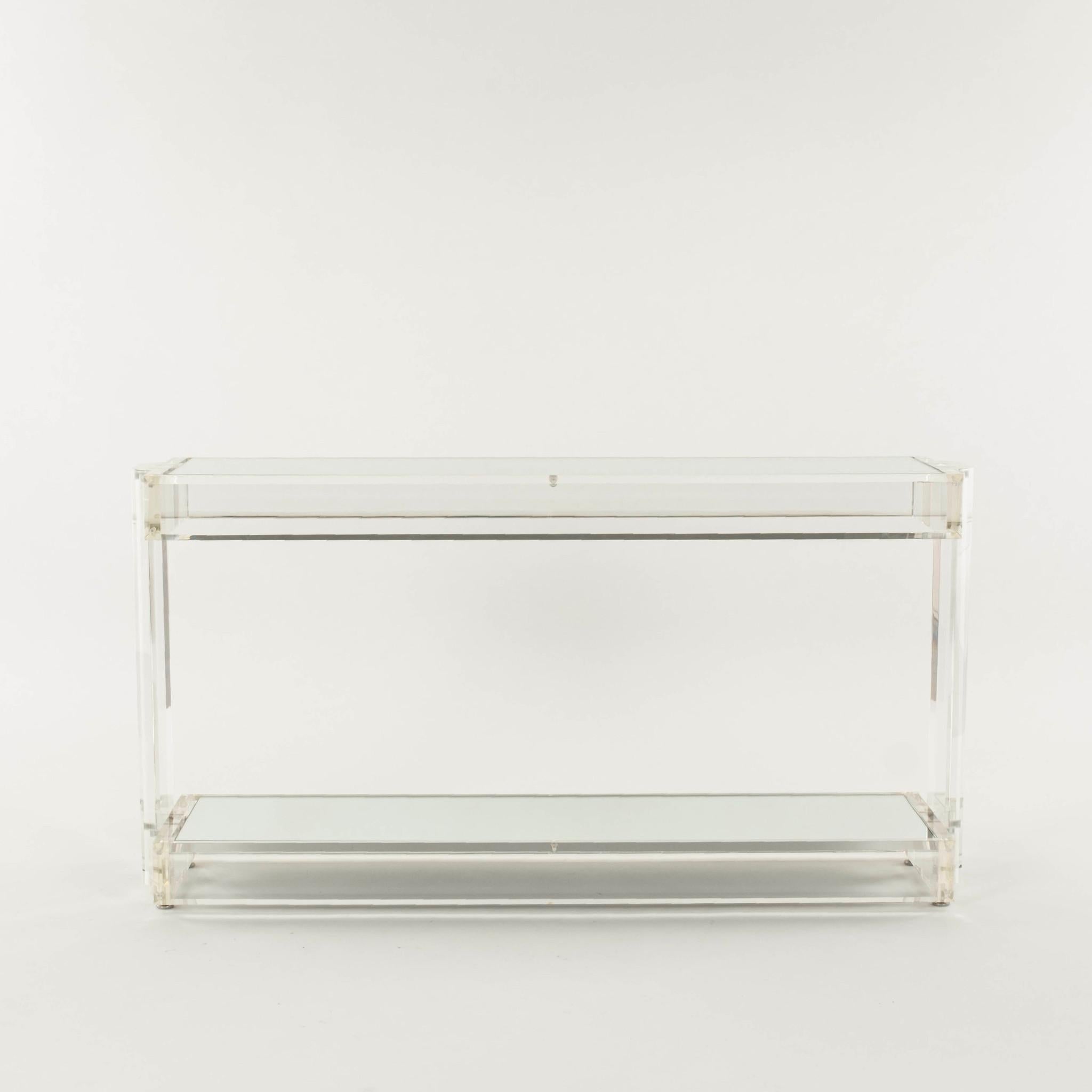 Vintage slab lucite consoled with mirrored top.