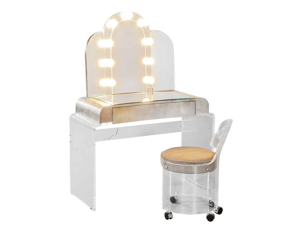 Step back in time with this exquisite Vintage Mirrored Modernist Lucite Acrylic Vanity Set, a stunning piece that captures the essence of 1970s design while maintaining its functional charm. Crafted in the USA, this striking set features a lustrous