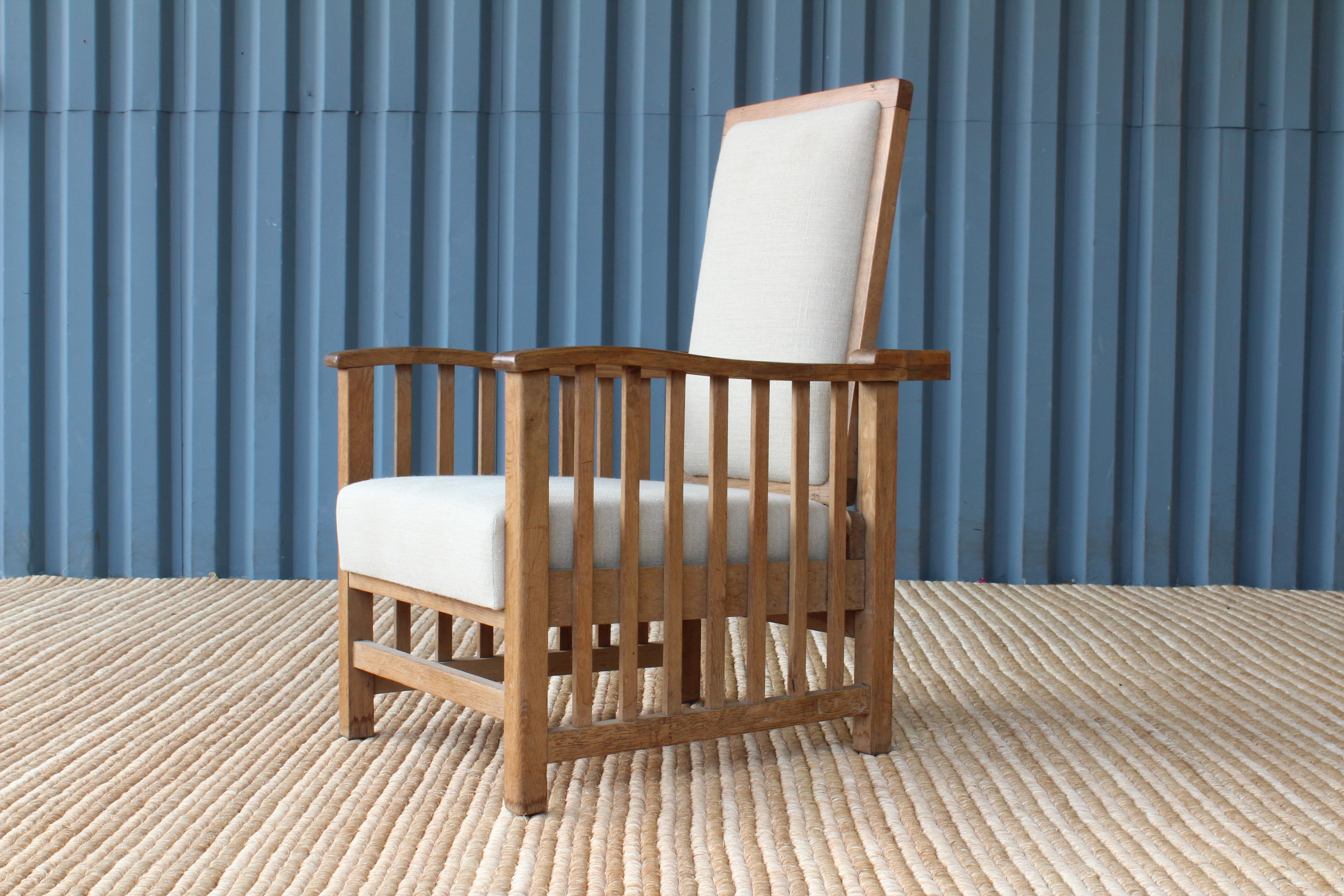 Vintage oak armchair with an adjustable back. New hemp linen fabric.
 