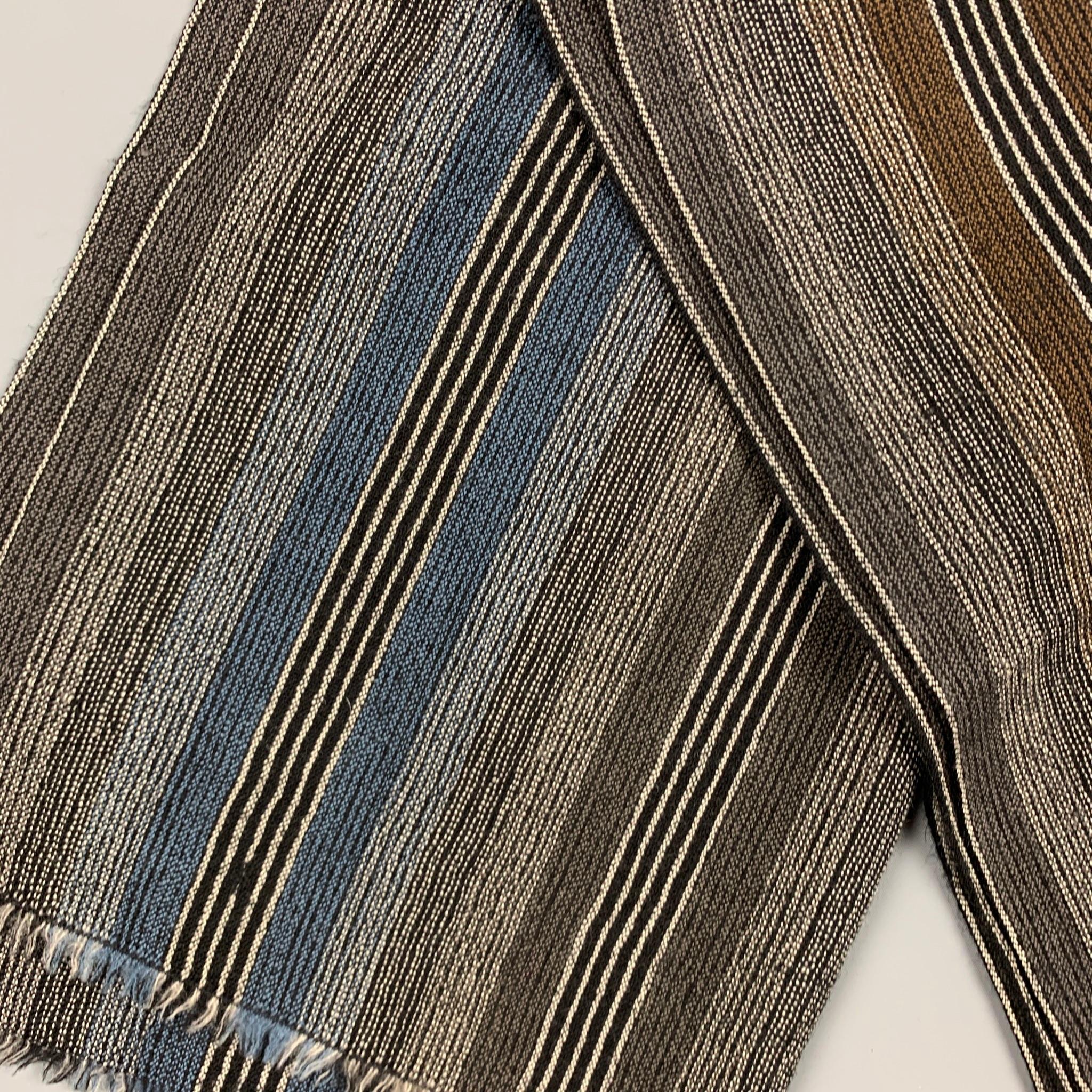 Vintage MISSONI scarf comes in a grey & brown stripe wool featuring a fringe trim. Made in Italy.

Very Good Pre-Owned Condition.

Measurements:

68 in. x 19 in. 