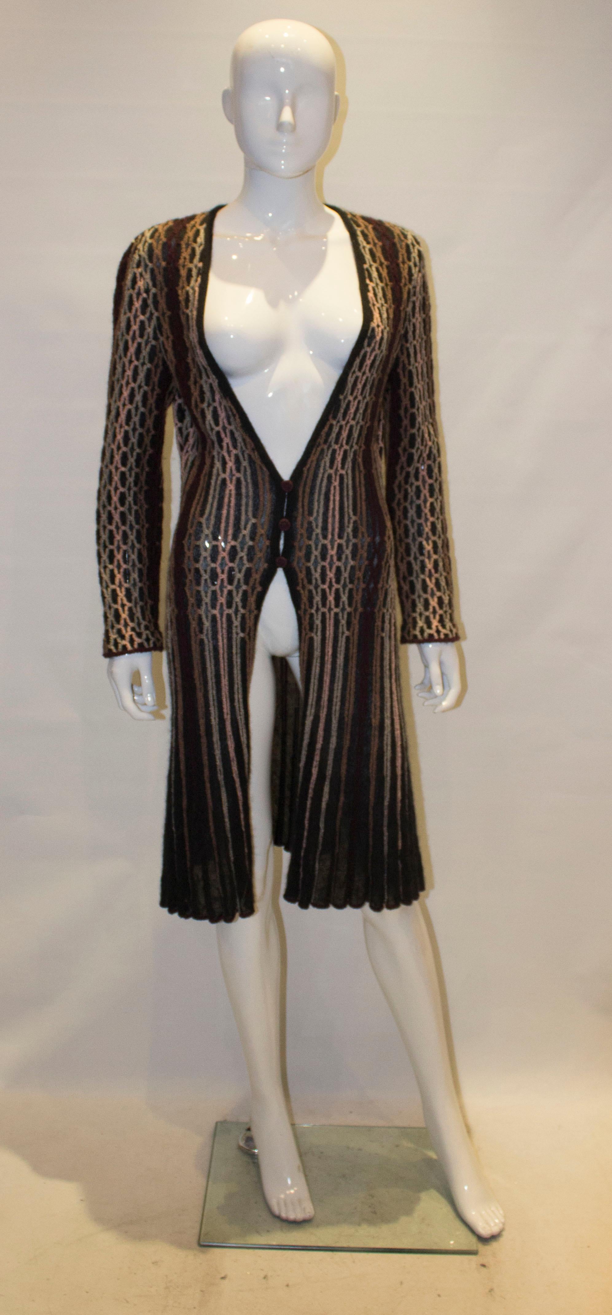 A vintage Missoni Brown Label Cardigan /Jacket . The jacket has a black background with multicolour stripes, a v neckline and a three button front opening.