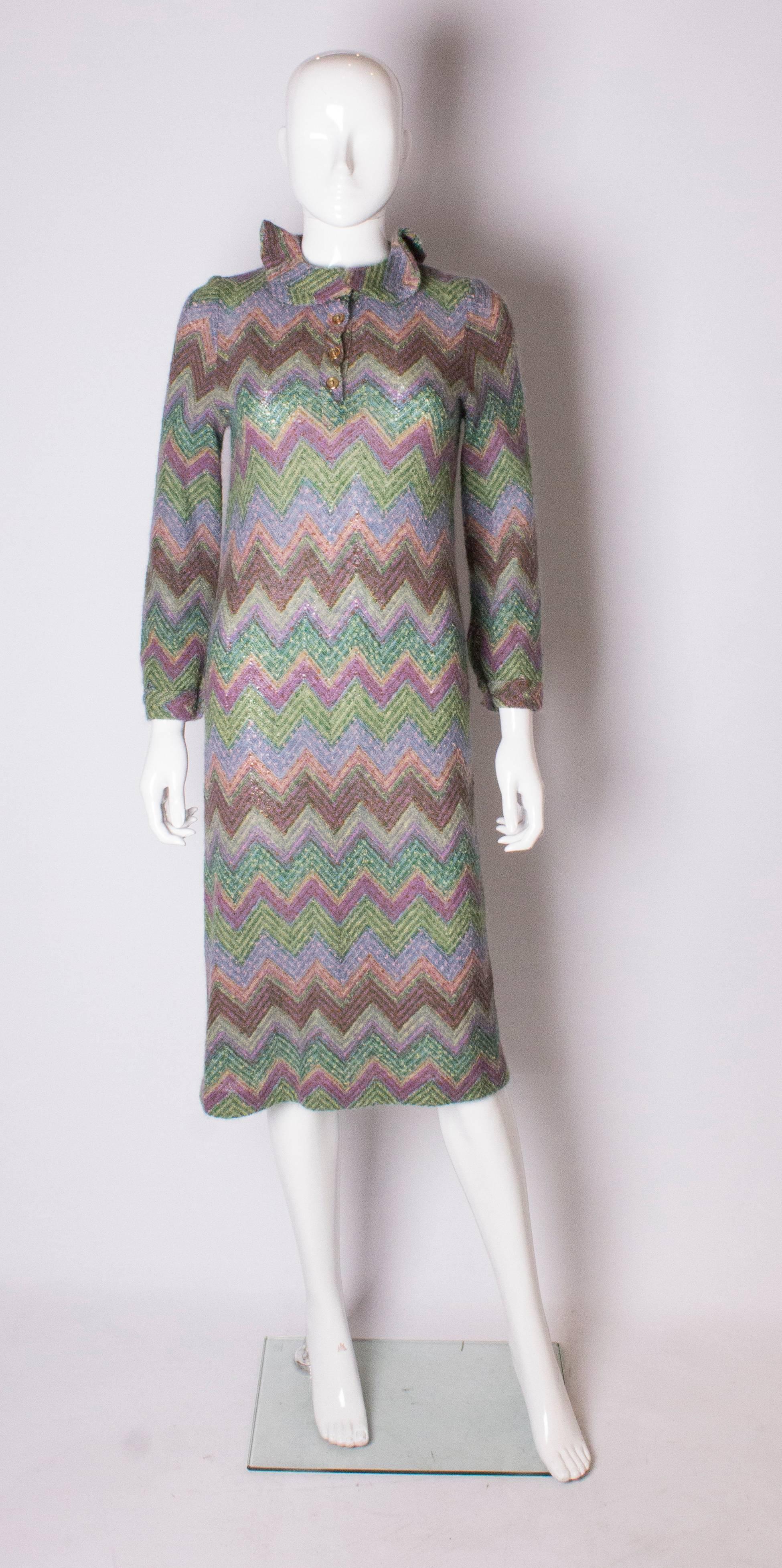 A great multi coloured knit dress by Missoni, main line. The dress has a ruffled collar, 4 button opening at the front with single button cuffs.
The fabric is 40 %vb mohair, 40 % wool and 20% nylon.