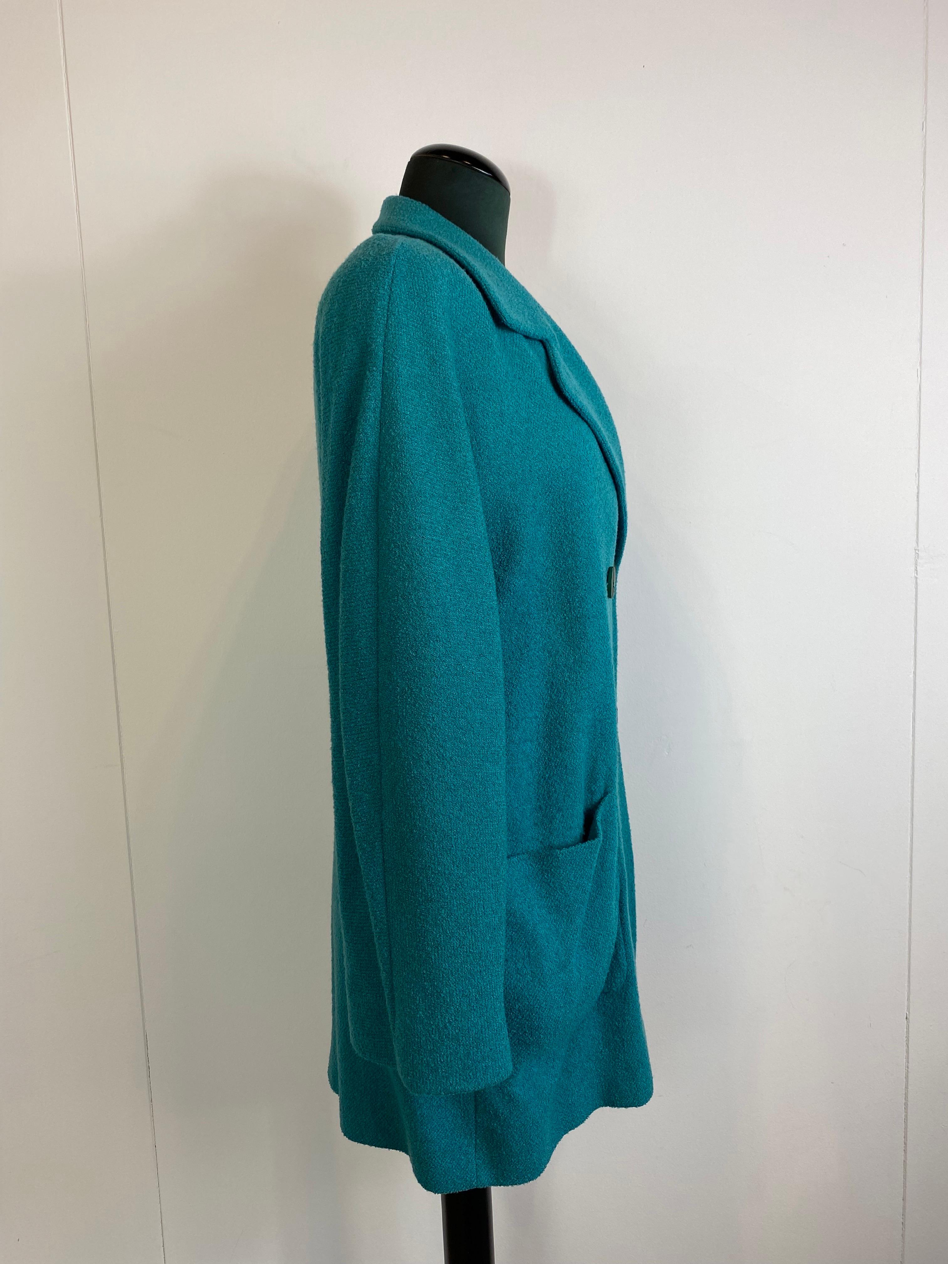 Vintage Missoni jacket, 85% wool. 
Teal. 
Double-breasted, classic lapels and kimono sleeves. 
Used but in very good condition. 
Shoulders 42 cm 
Bust 52 cm
Waist 50 cm
Total length 84 cm
Sleeve length 58 cm

Skirt

Waist 35 cm
Hips 47 cm
Lenght 65