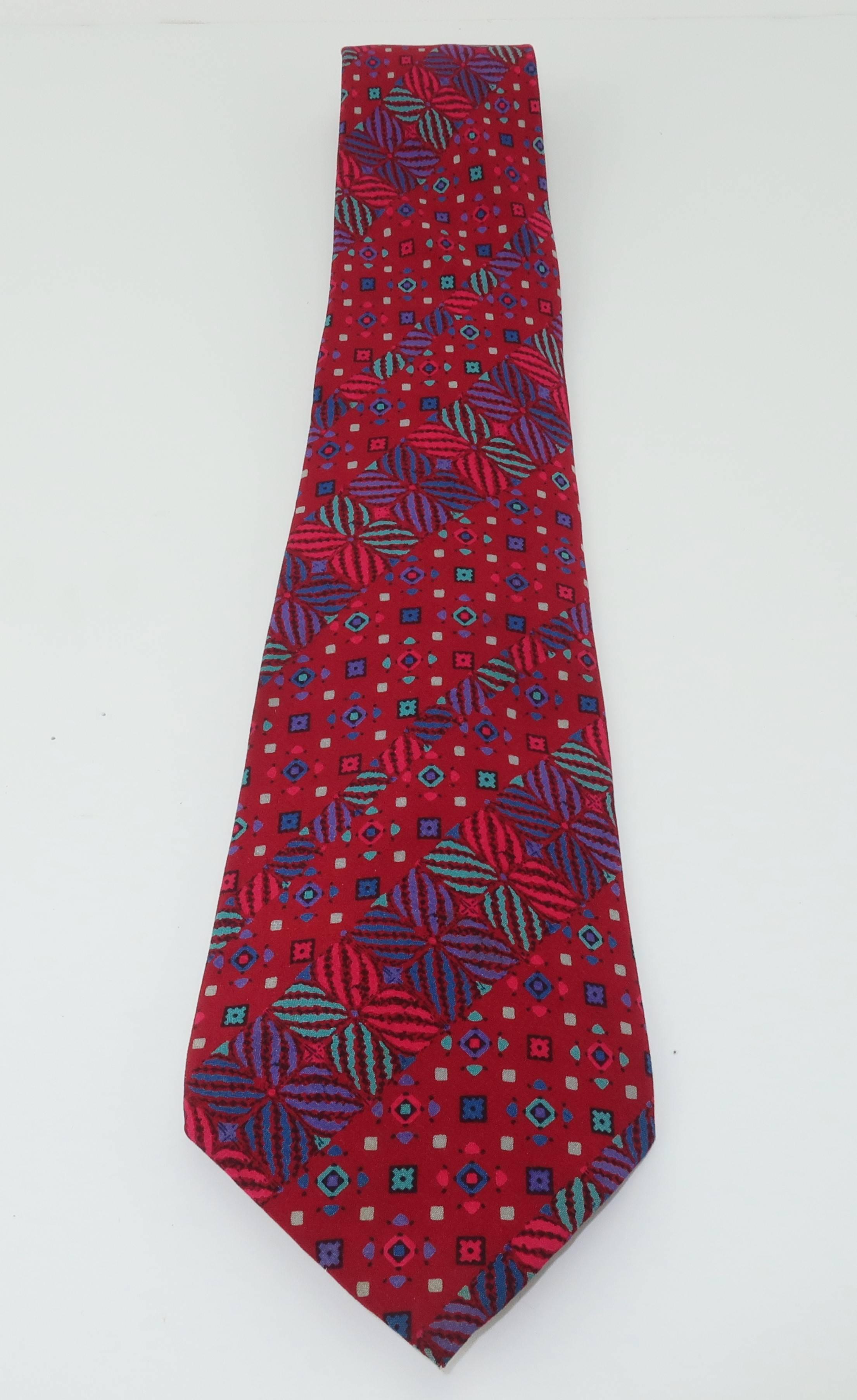 Missoni creates a menswear silk necktie in shades of deep ruby red, teal blues and greens with plum accents.  The geometric design has a playful vibe and it is beautifully made with the quality one would expect from Missoni.  Good condition with a