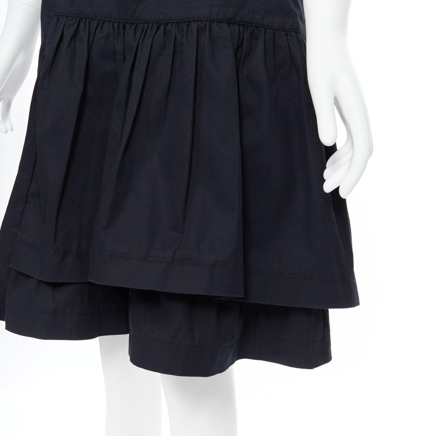vintage MIU MIU black cotton pleated tiered flared knee skirt IT40
Reference: CEWG/A00030
Brand: Miu Miu
Designer: Miuccia Prada
Model: Flare skirt
Collection: 2008
Material: Cotton, Blend
Color: Black
Pattern: Solid
Closure: Zip
Extra Details: