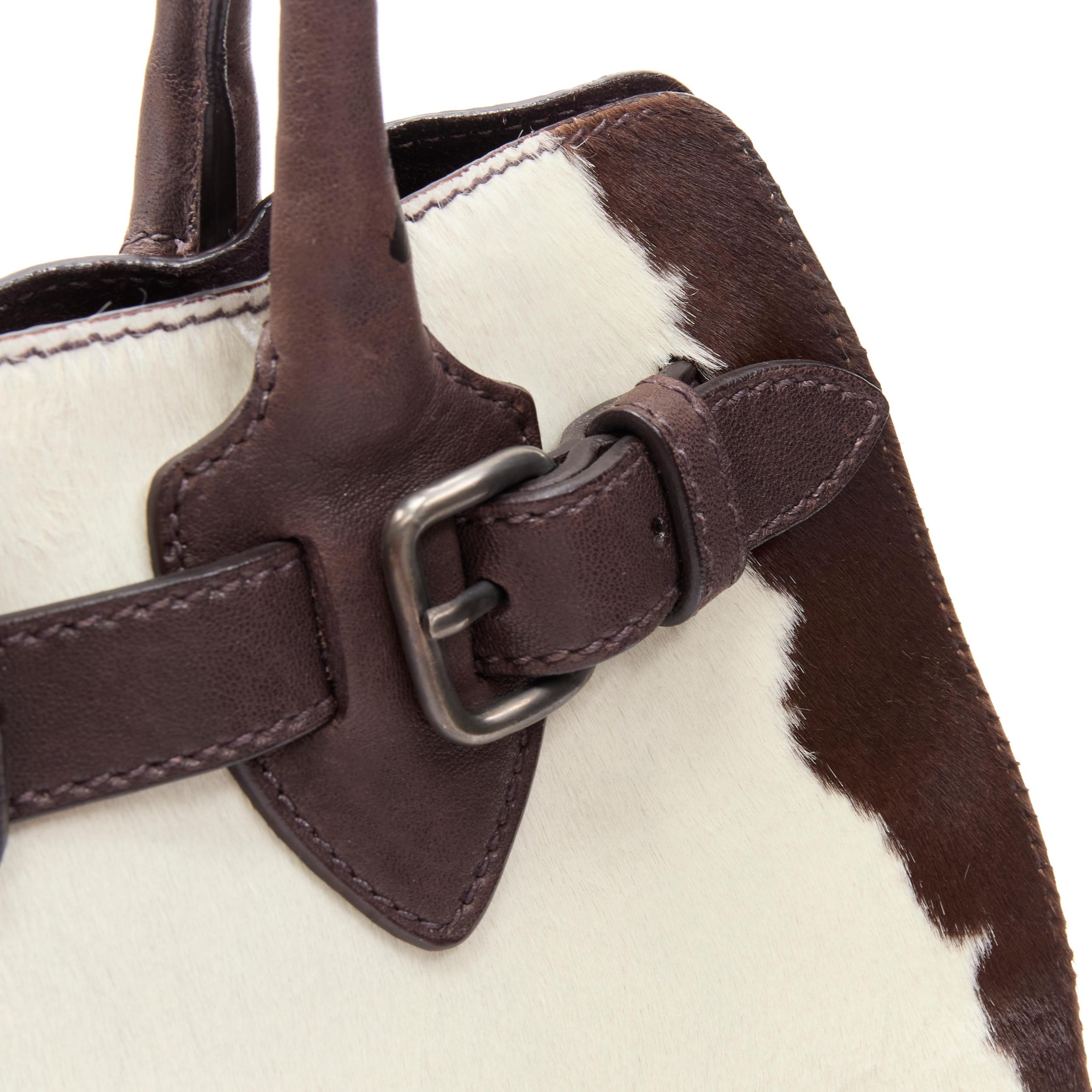 Women's vintage MIU MIU brown white cow print horse half red lock satchel bag