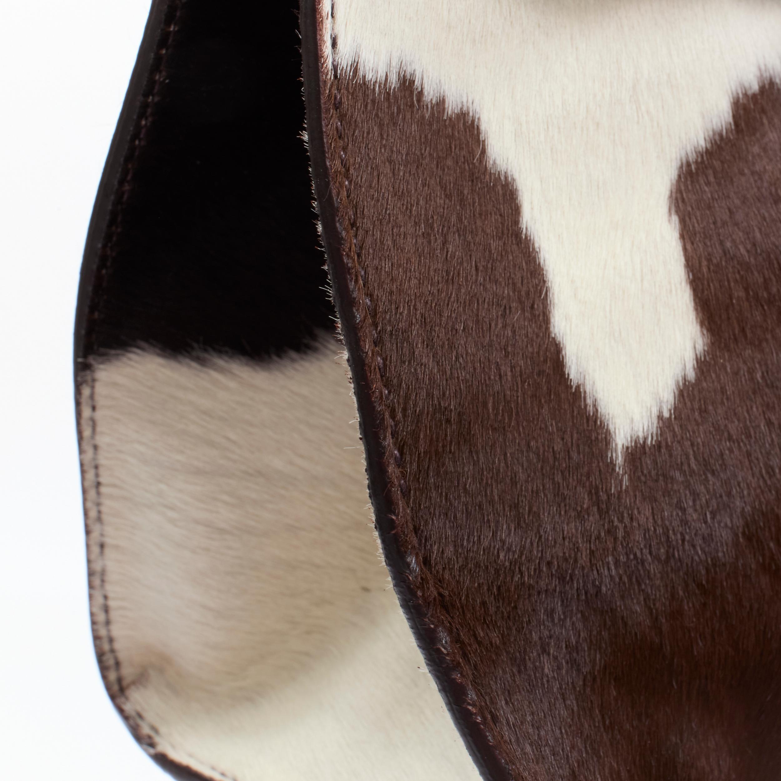 Women's vintage MIU MIU brown white cow print horse half red lock satchel bag