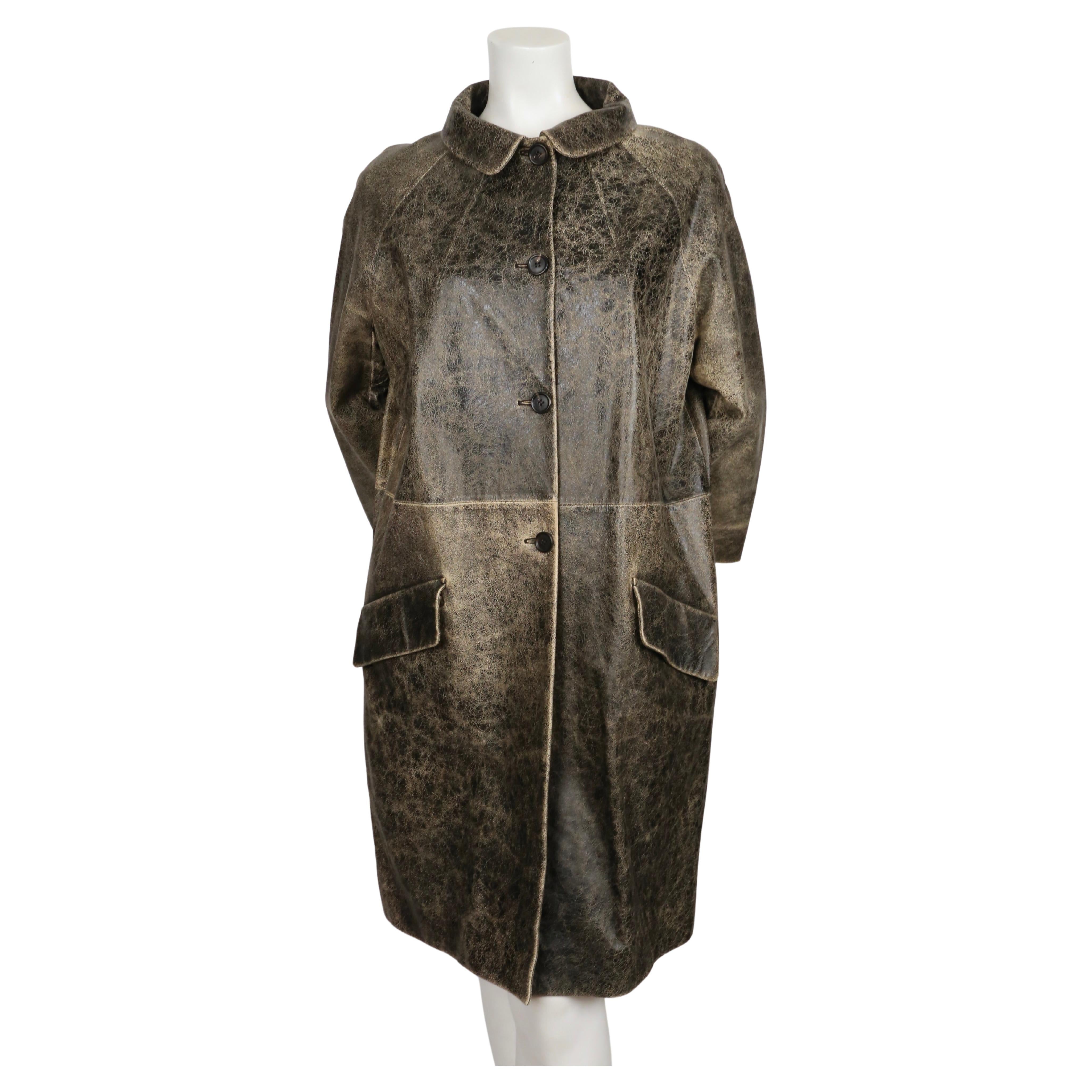 Very rare 'distressed' leather coat with three quarter sleeves designed by Miuccia Prada for  Miu Miu dating to around 2010. Very beautiful early 1960's silhouette. Italian size 42. Approximate measurements: bust 46