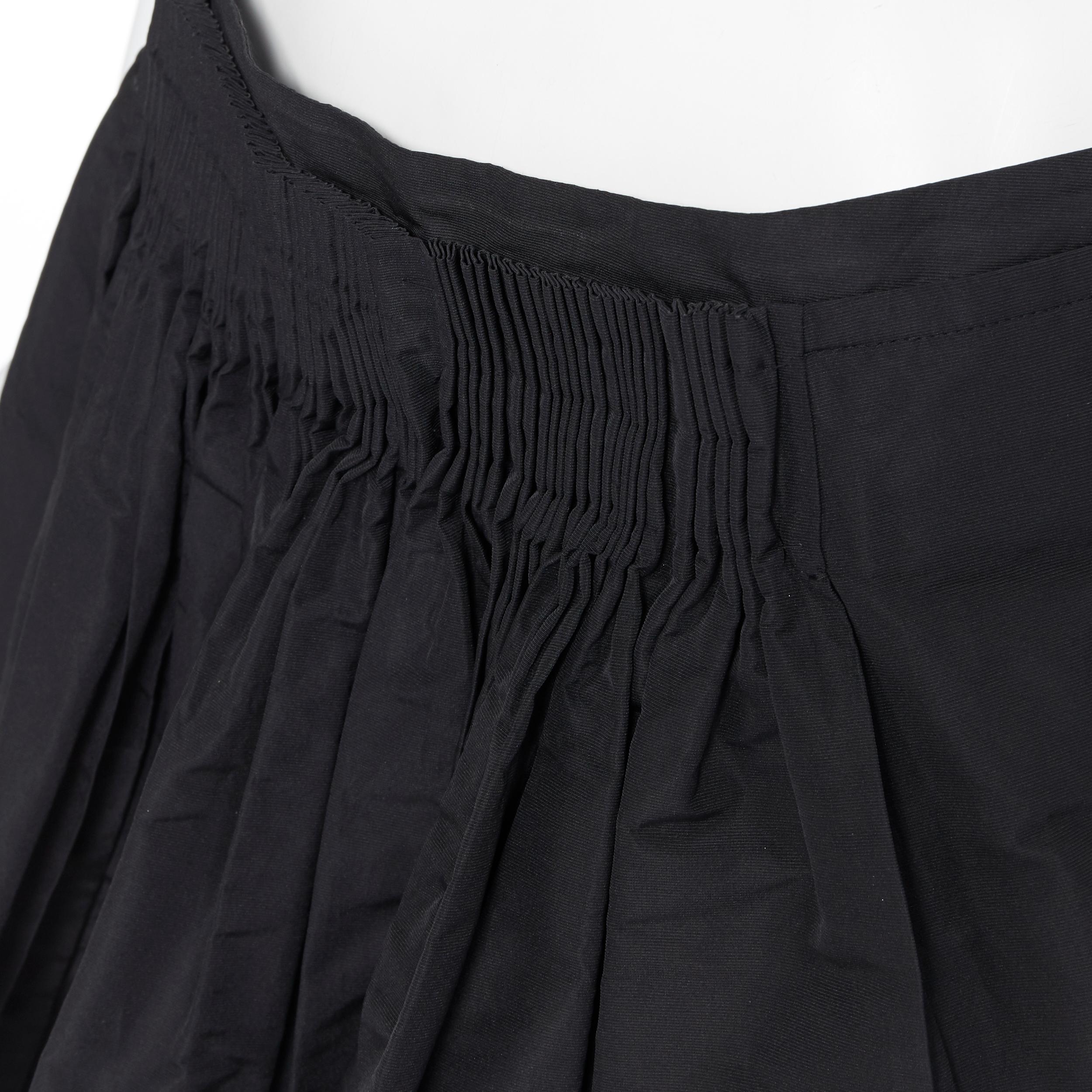 vintage MIU MIU polyester acetate pleated dual slit pocket flared skirt IT40
Brand: Miu Miu
Designer: Miuccia Prada
Collection: 2007
Model Name / Style: Flare skirt
Material: Polyester, acetate
Color: Black
Pattern: Solid
Closure: Zip
Extra Detail: