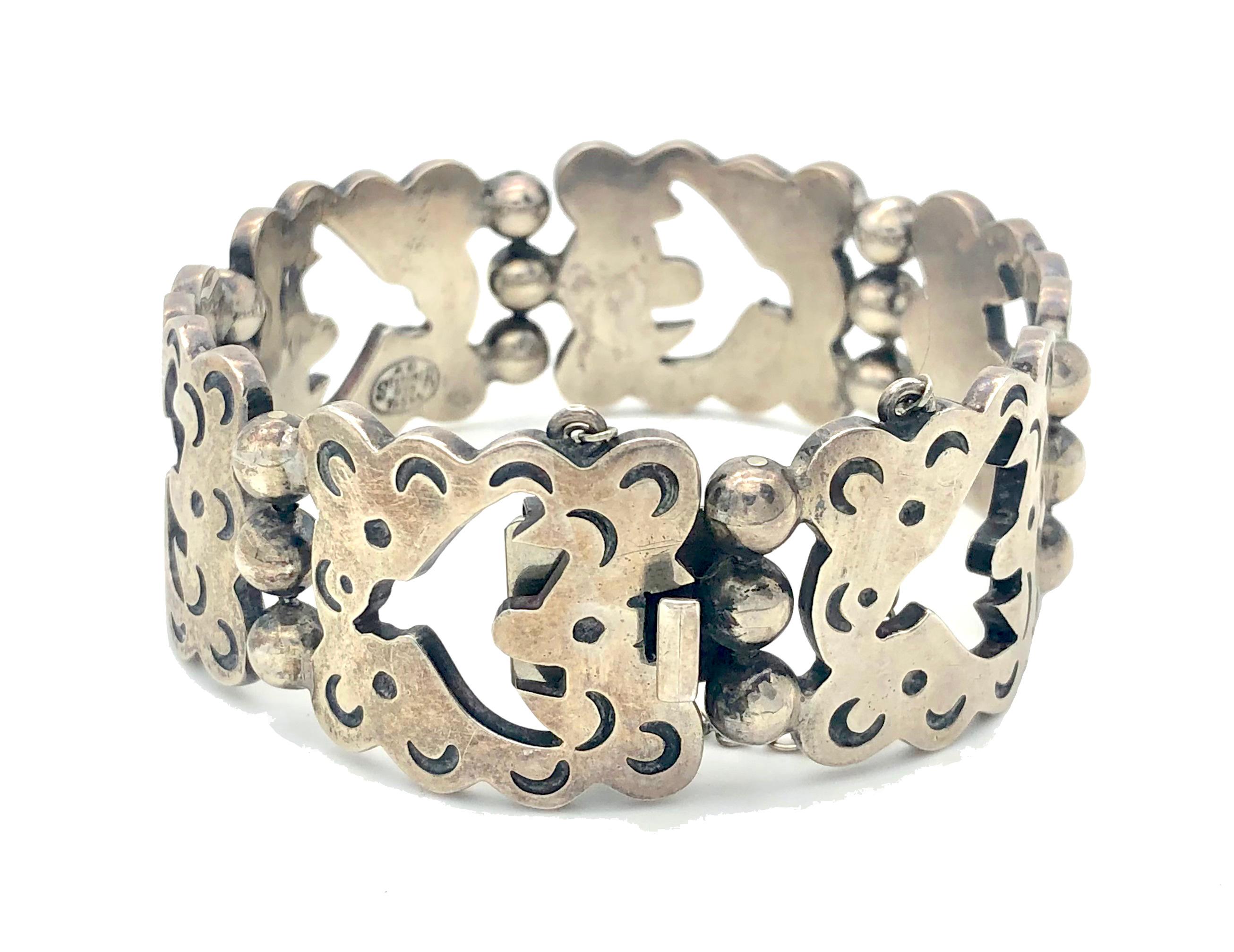 This fully signed sterling silver bracelet is marked with Mexican silver marks with the makers initials AD. Each link has wavy edges and features a cut out dove of peace, possibly after a design by Georges Braque solid. The hinges are designed as