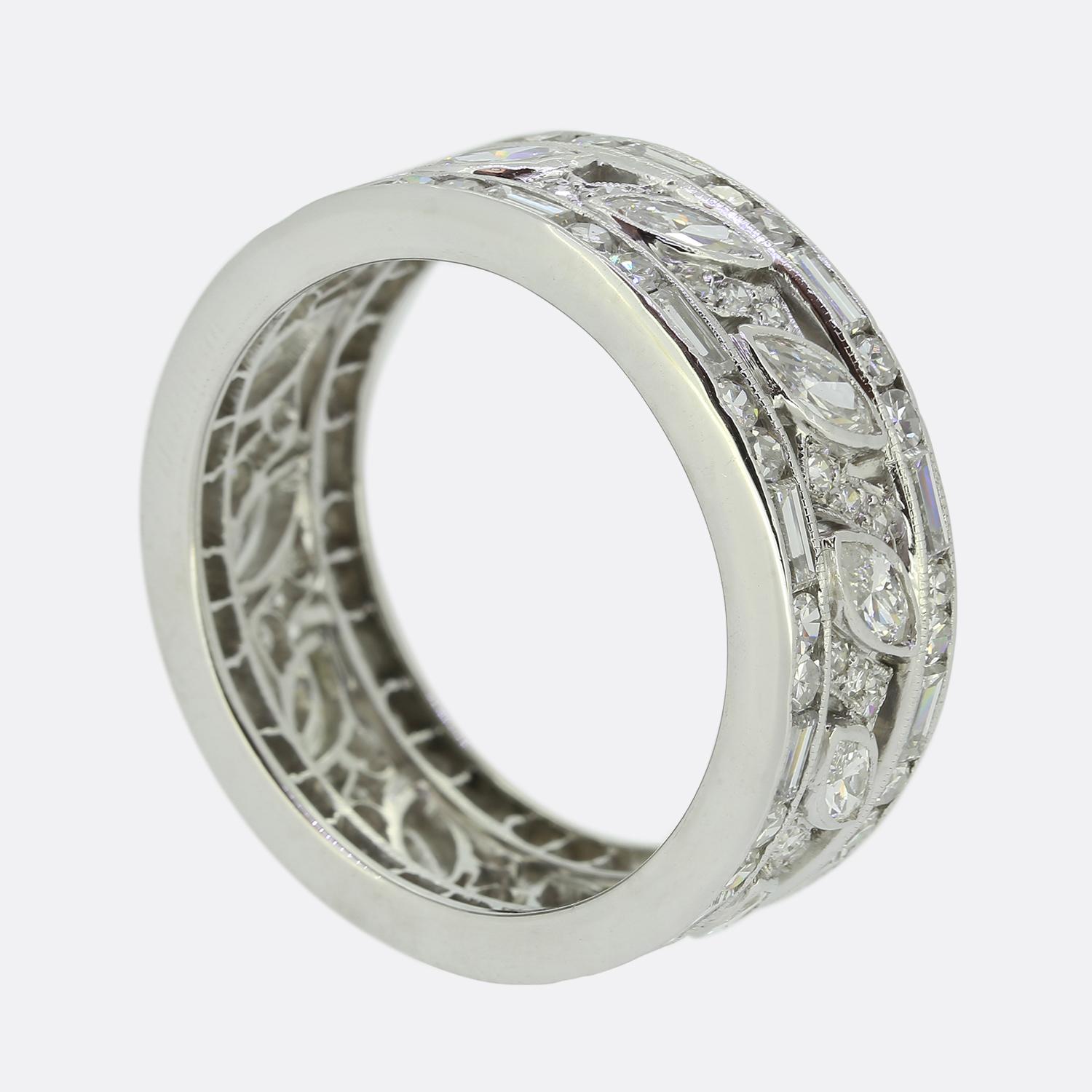 Here we have a wonderfully unique eternity ring taken from the pinnacle of the Art Deco movement. This elegant piece has been crafted from platinum and is set with an alternating array of marquise and eight cut diamonds at the centre. This open