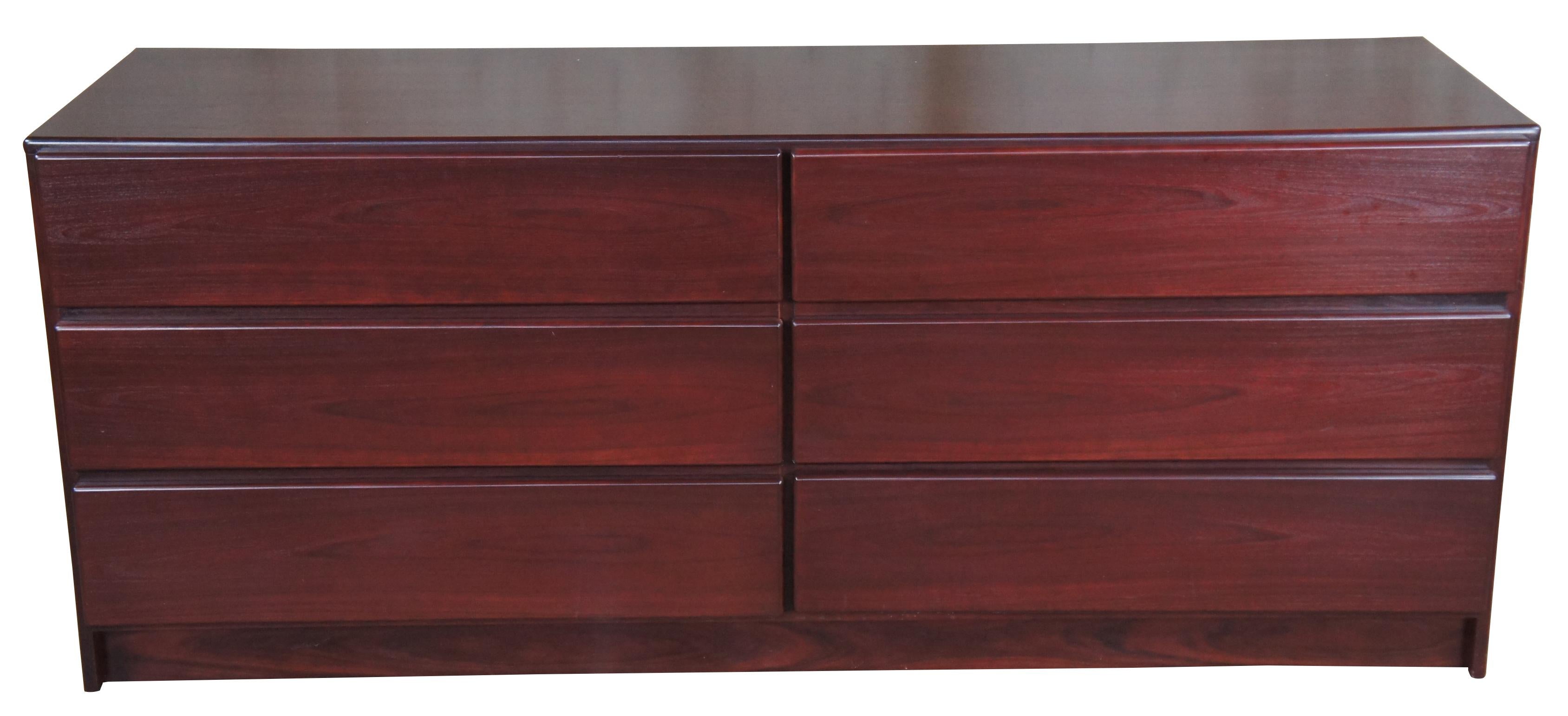 Mobican Danish Modern double dresser and mirror. Made from Rosewood with with a sleek design featuring six larger drawers and removable mirror.

Mobican is a Canadian Luxury furniture manufacturer. They are a family owned business with roots in