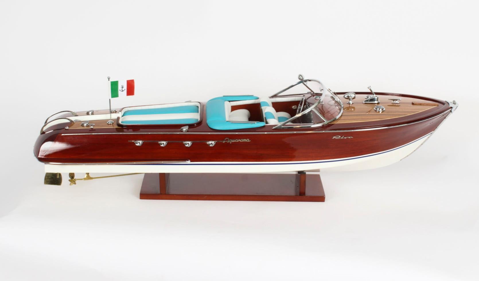 This is an exceptional handbuilt model of the “Riva Aquarama”, a luxury wooden launch built by the Italian yactbuilder Riva and  late 20th Century in date.

In production from 1962 to 1996, the Aquarama was the most famous of Carlo Riva’s luxury