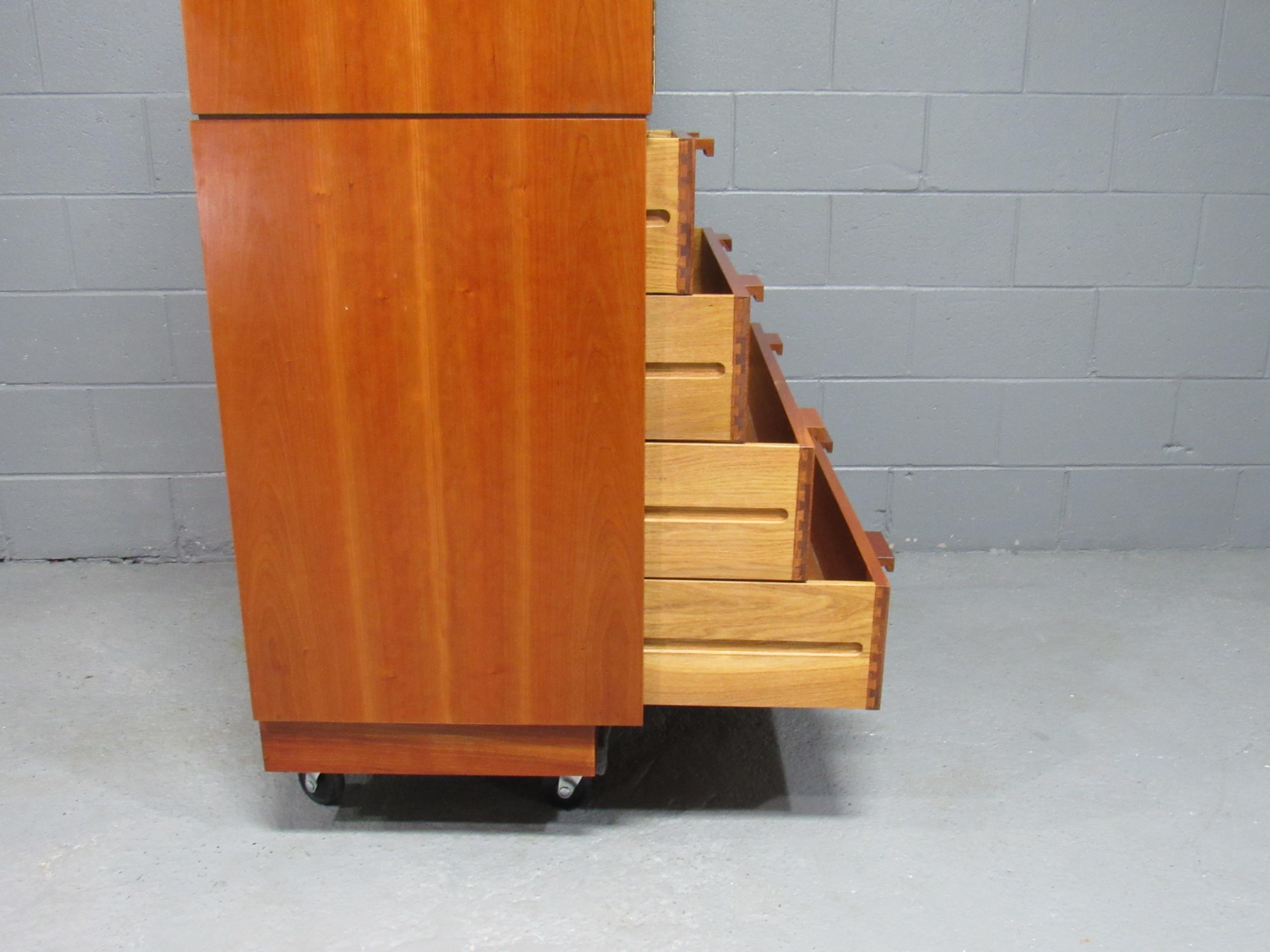 Vintage modern 1980s solid cherry wardrobe and chest of drawers by Charles Webb. Simple yet elegant design and impeccable craftsmanship are the hallmarks of Charles Webb's design. The solid cherrywood has gorgeous graining and patina. Top cabinet