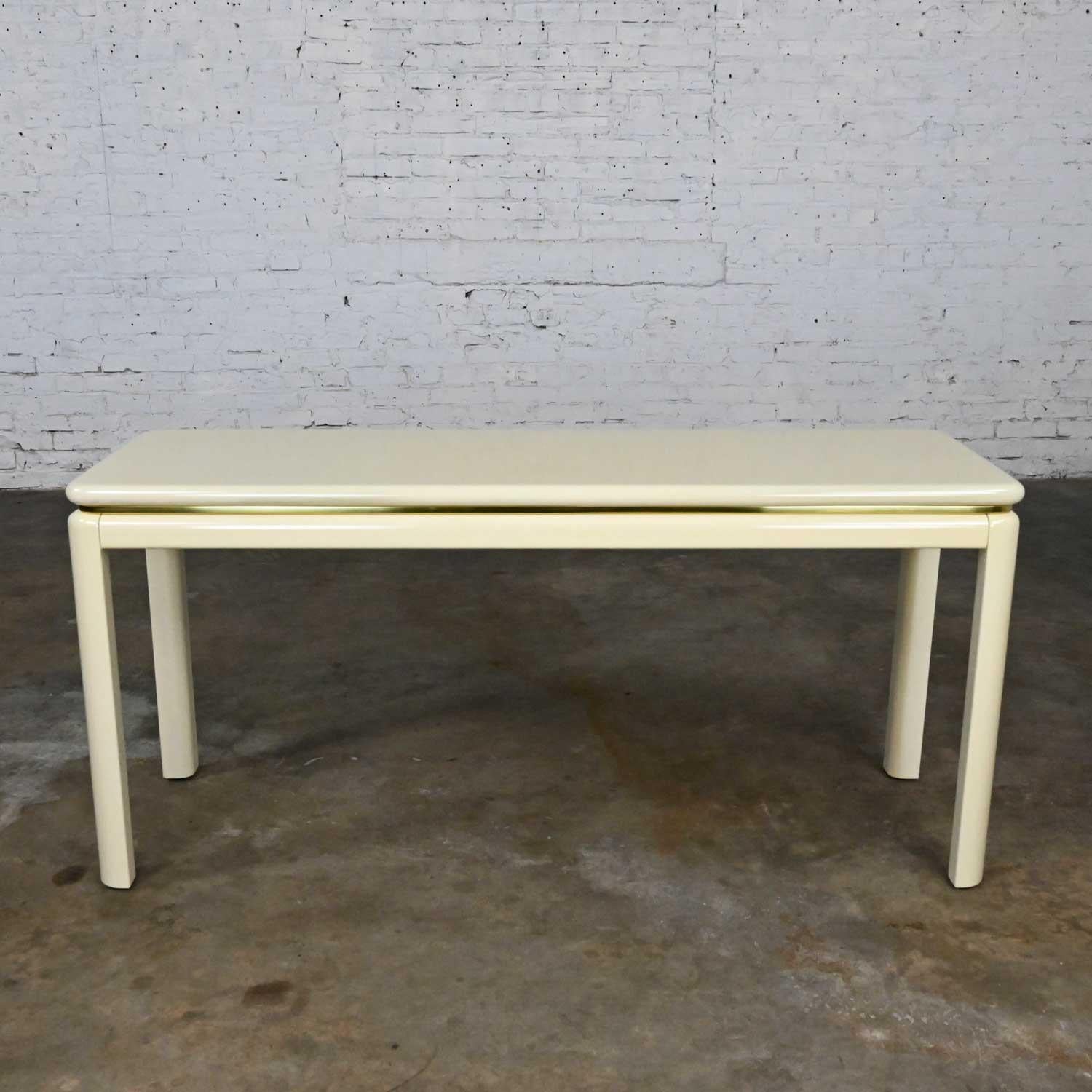 Lovely vintage modern or Art Deco Revival white lacquer and brass trim sofa console table by Lane. Beautiful condition, keeping in mind that this is vintage and not new so will have signs of use and wear. It had several nicks or chips that have been