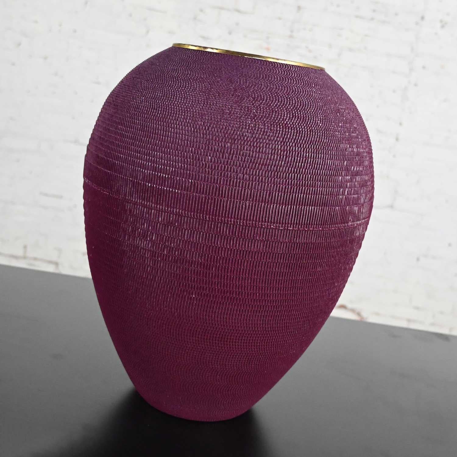 Lovely vintage modern aubergine painted corrugated cardboard large urn shaped floor vessel vase with brass plated brim in the style of Gregory Van Pelt’s Flute Lamp. Beautiful condition, keeping in mind that this is vintage and not new so will have