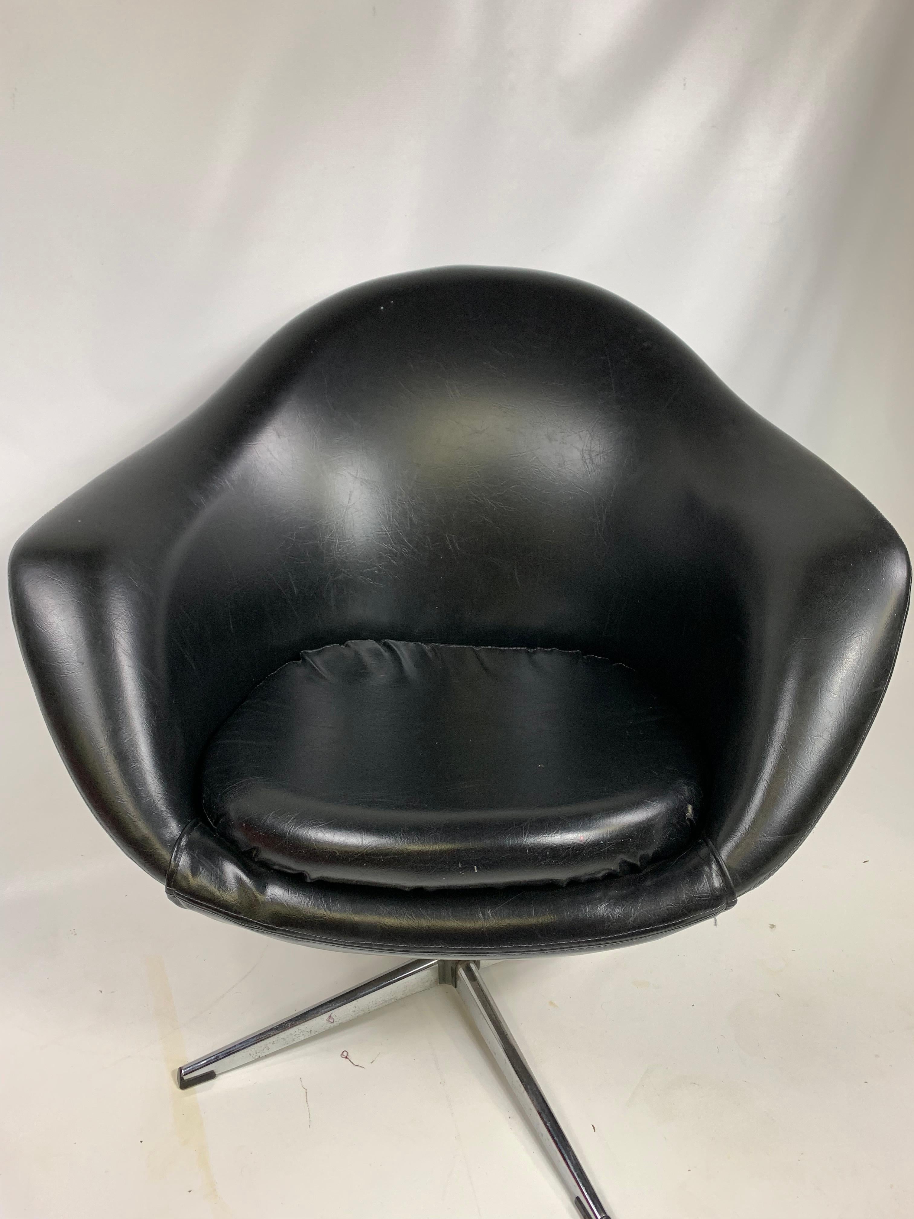 Vintage modern black overman swivel pod chair.