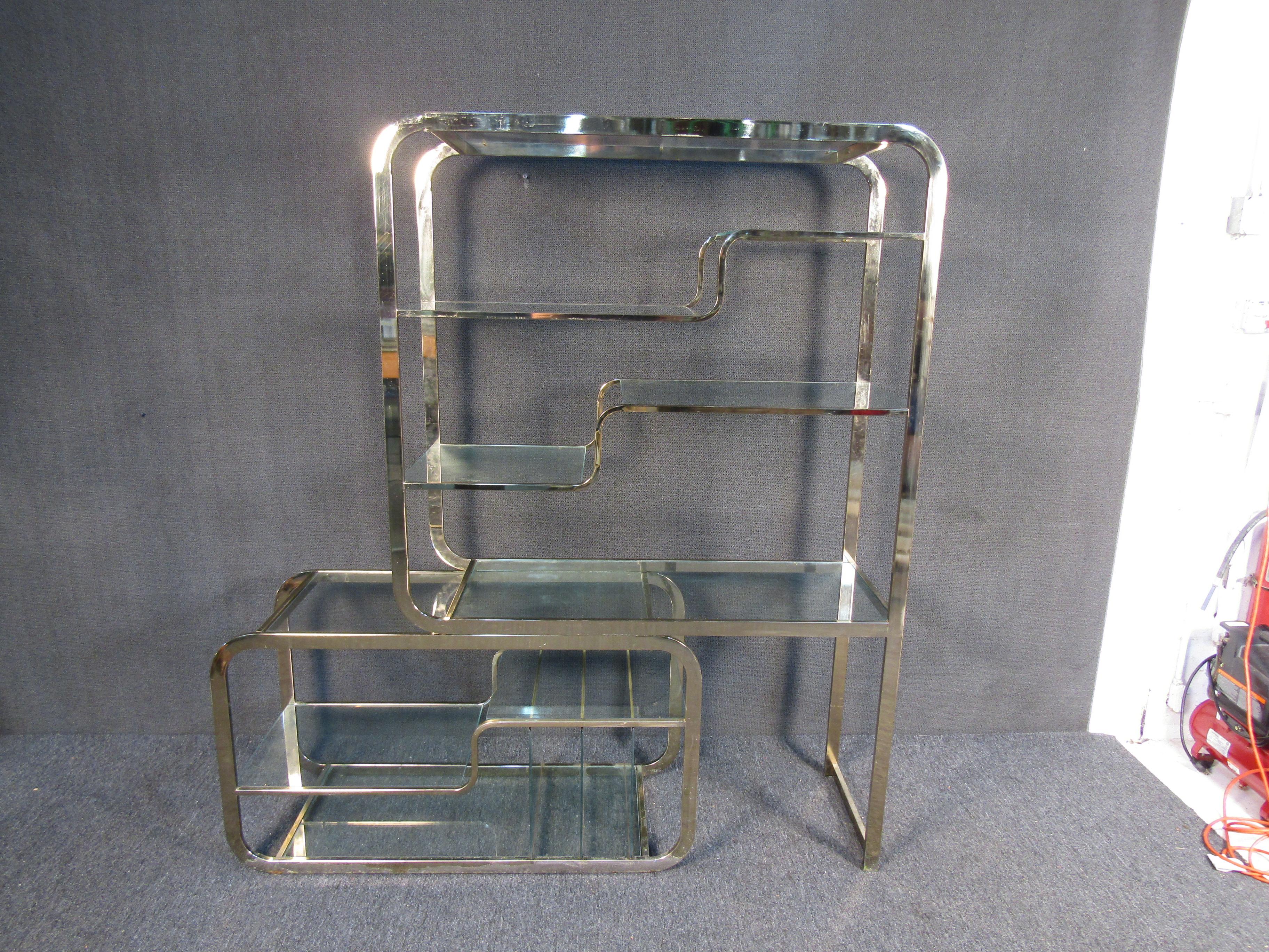 A stunning Mid-Century Modern brass and glass etagere by DIA. Sleek design with a base piece that slides to fit any office/home/bedroom. 

(Please confirm item location - NY or NJ - with dealer).