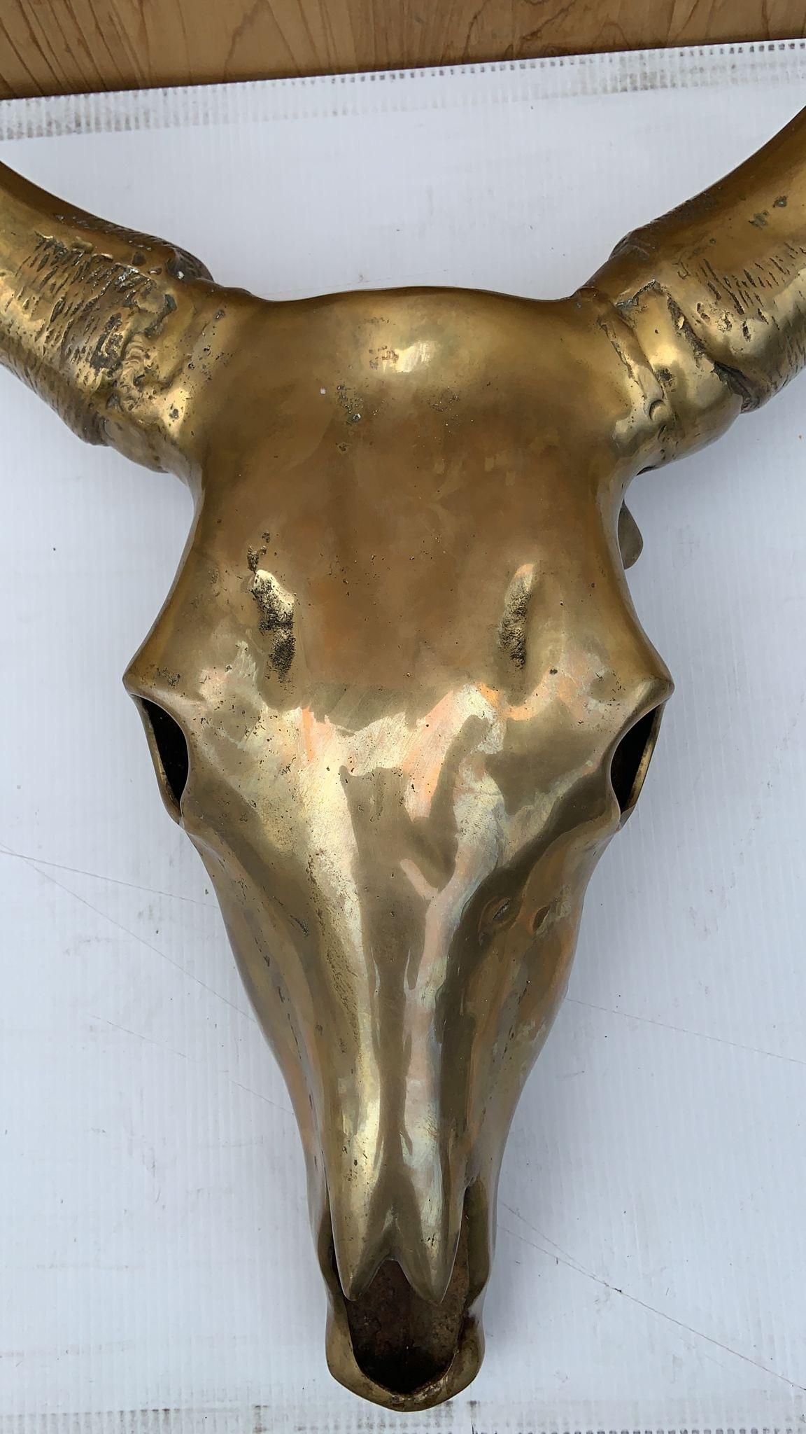 Vintage Modern Brass Cow Skull Wall Mounted Sculpture
Beautiful Brass Cow Head Skull Wall Mounted Sculpture,
circa 1960
Dimensions:
D 6.5”
W 22” (widest Horn part)
W 9” (by the eyes)
H 29”.