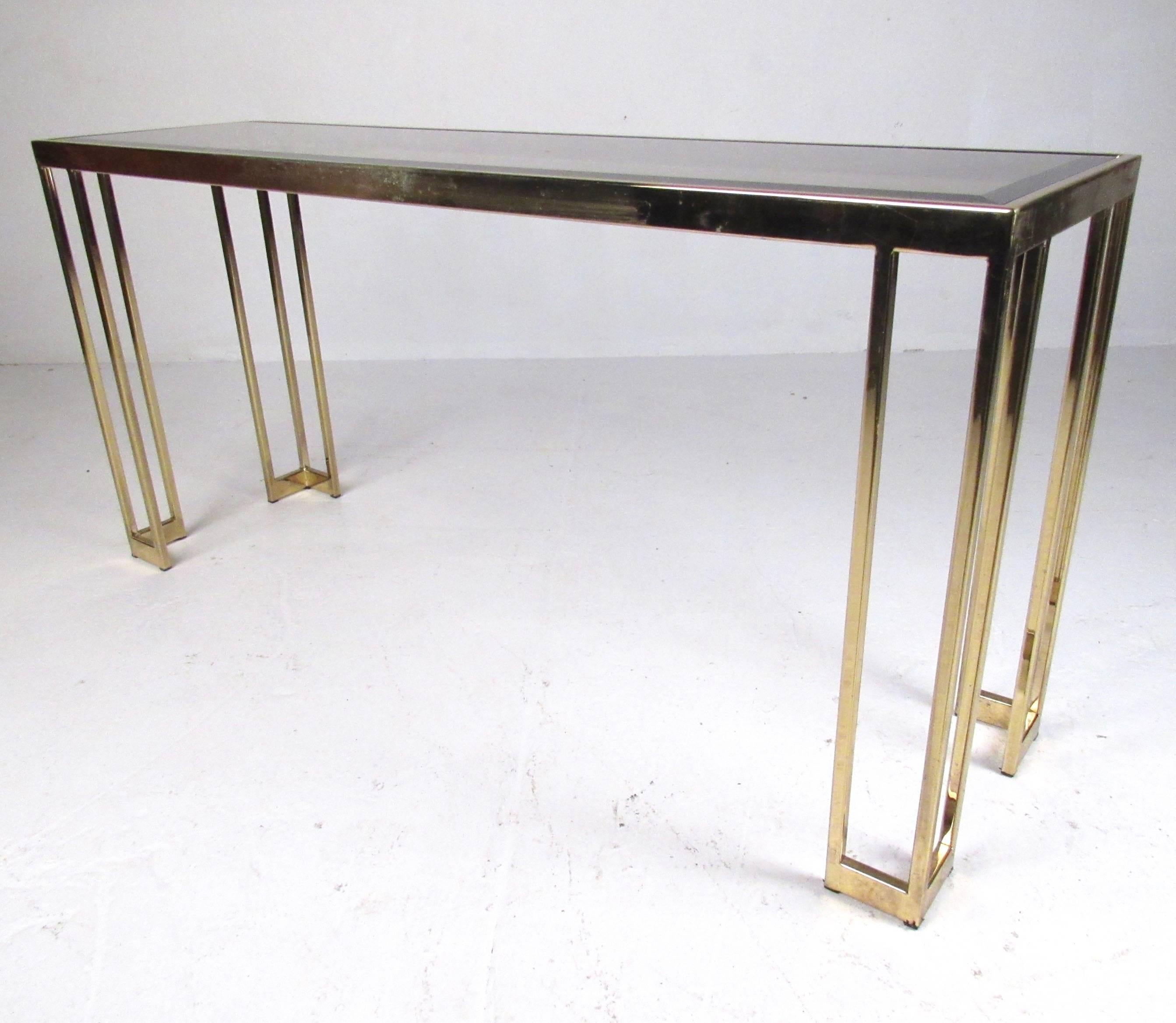 This bevel glass top table features bronze finish frame and shapely midcentury style. Perfect dimensions for use as an entryway console, hall display, or as a sofa table. Please confirm item location (NY or NJ).