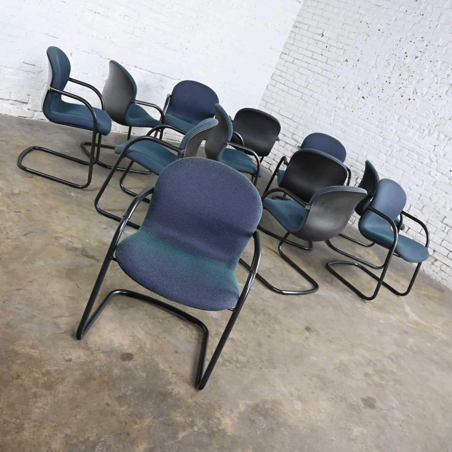 Handsome vintage Modern discontinued Bulldog Armed Side Chairs by Michael McCoy & Dale Fahnstrom for Knoll with black cantilever bases and blue fabric 12 total. Beautiful condition, keeping in mind that these are vintage and not new so will have