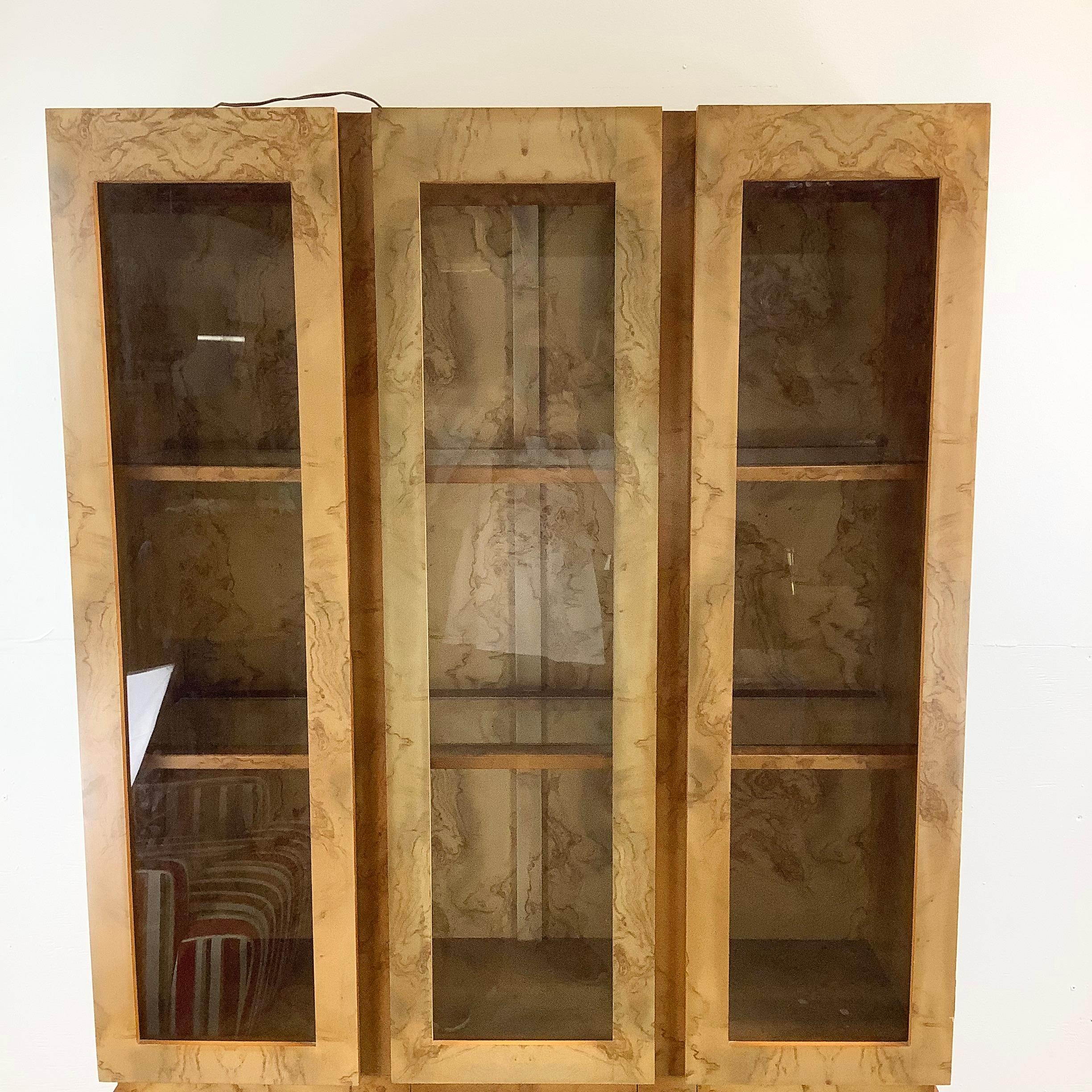 Introducing this Vintage Modern Burl Style Curio Display Cabinet, a remarkable piece that combines elegance and functionality. Available now, this cabinet is a stunning showcase for your cherished collectibles.

Crafted with meticulous attention to