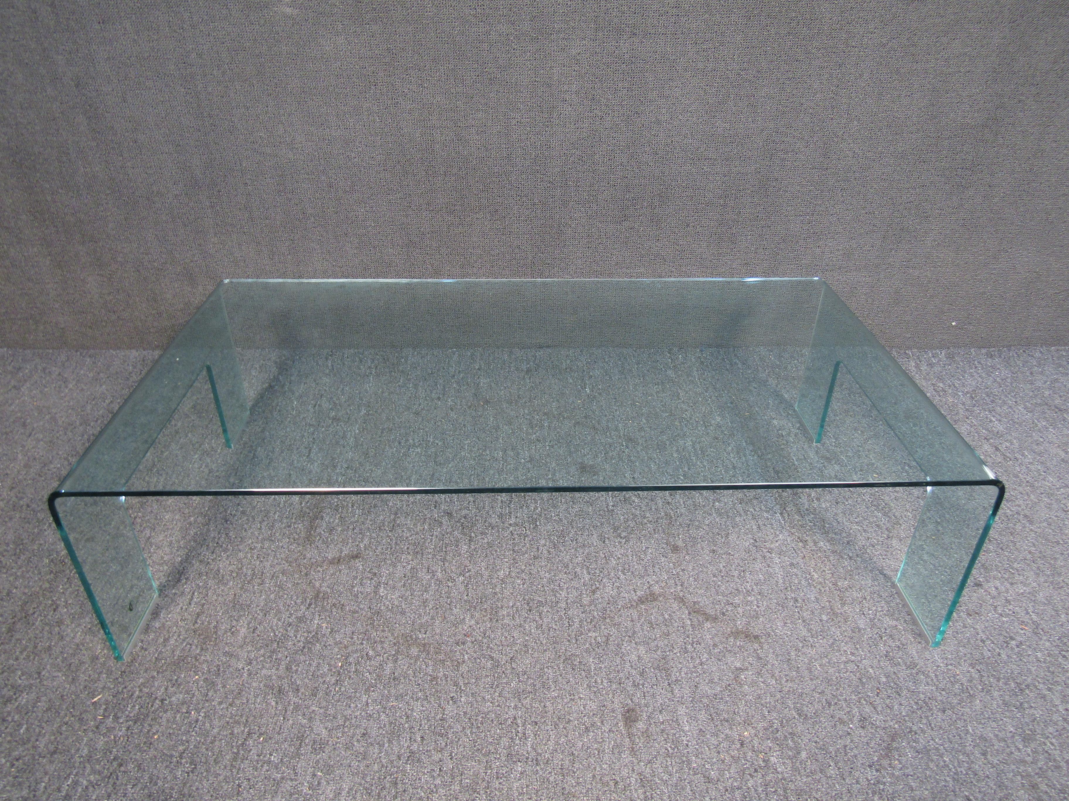This stunning but simple Coffee Table will make a statement in any modern home. It features a sleek all glass construction that will open up the space and reflect the other elements in the room. 

 Please confirm item location with seller (NY/NJ).