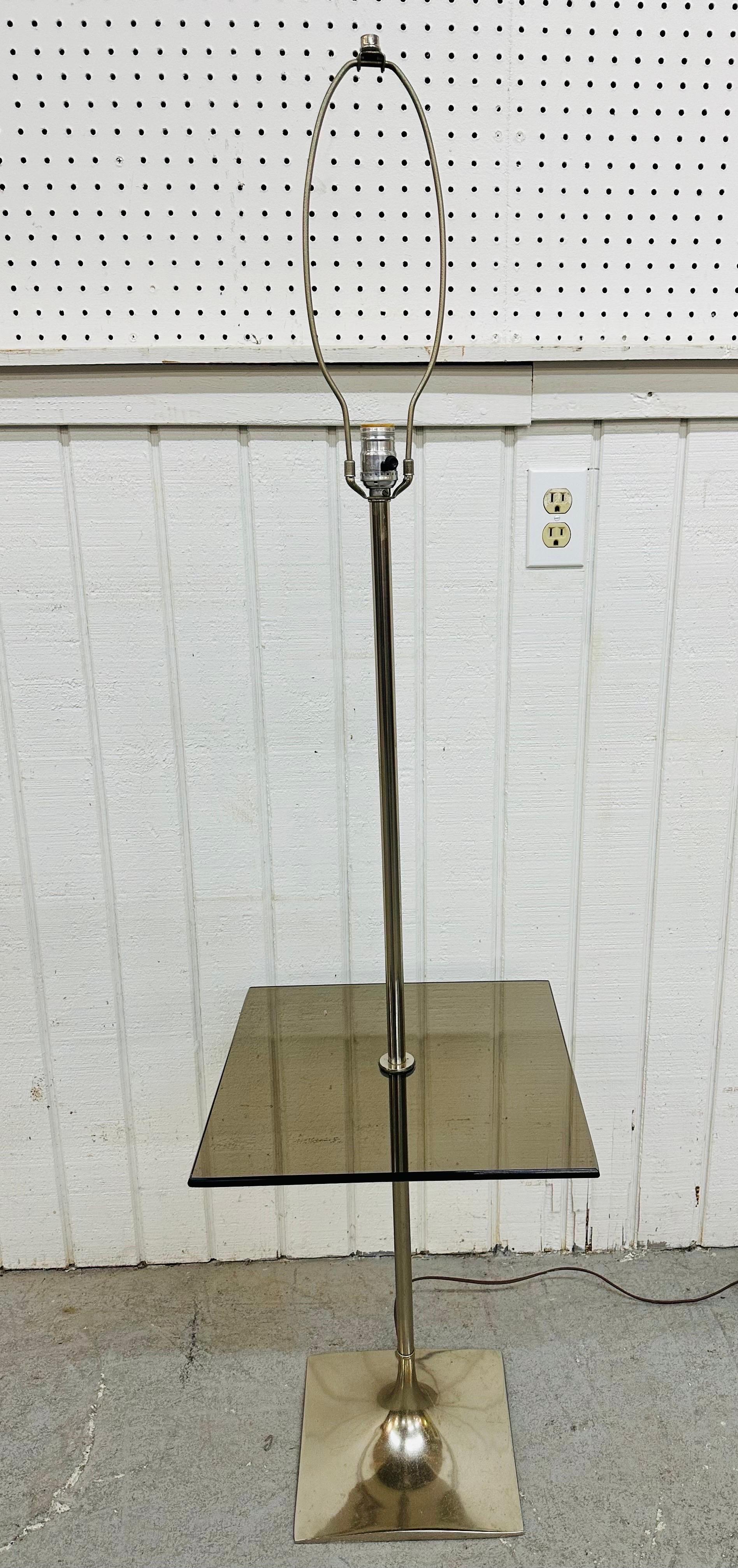 This listing is for a vintage Modern Chrome Floor Lamp. Featuring a chrome body, square smoked glass shelf, and original cord. This is an exceptional combination of quality and design!