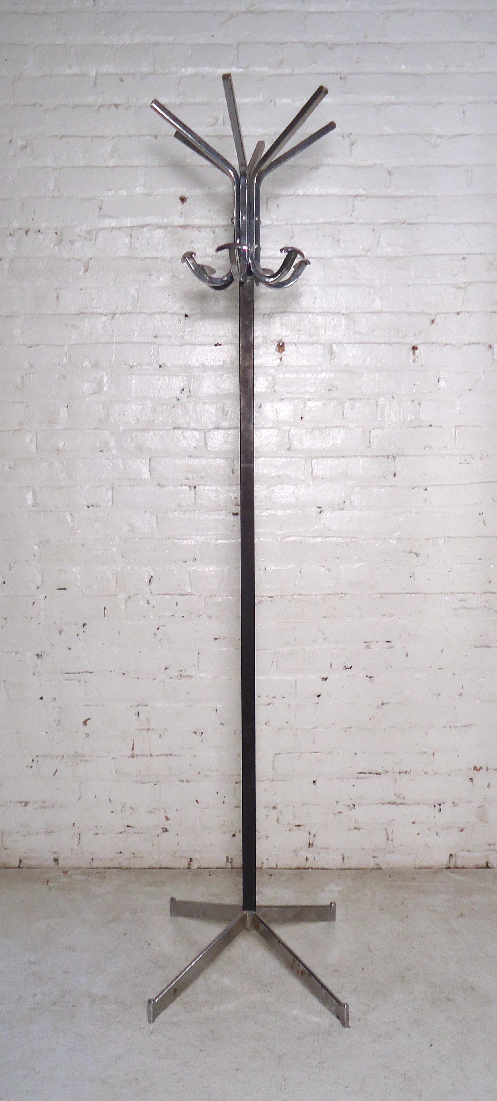 Sleek Industrial coat rack in metal featuring splayed bars to place your hats and jackets.
(Please confirm item location - NY or NJ - with dealer).