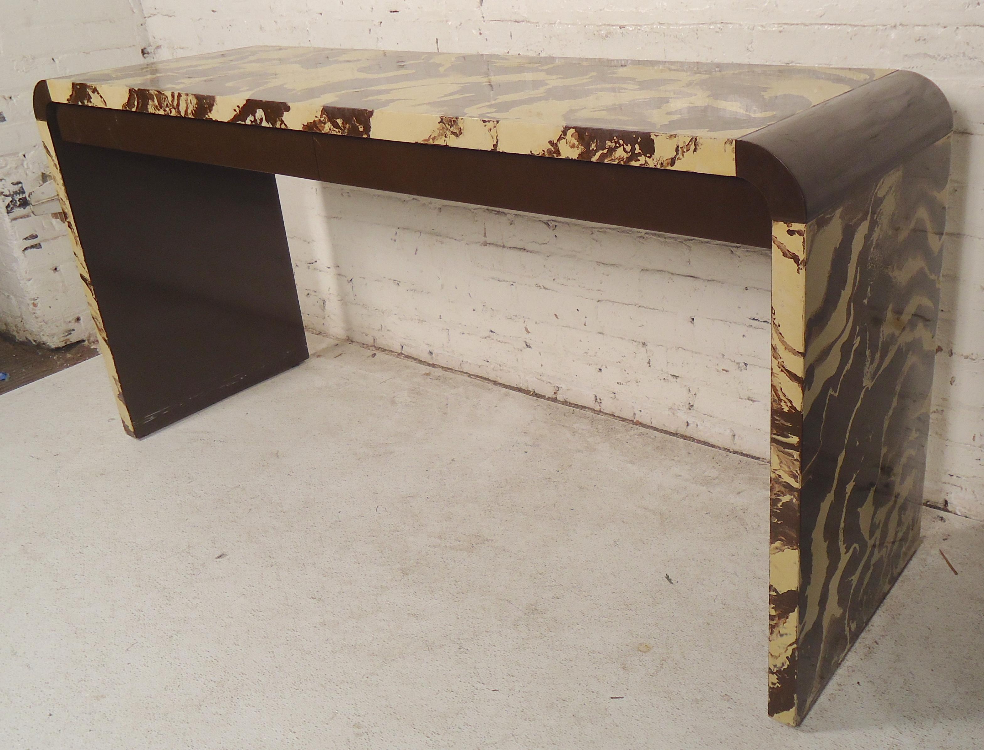 Unusual midcentury console table with marbling color and two storage drawers.
(Please confirm item location - NY or NJ - with dealer).
 